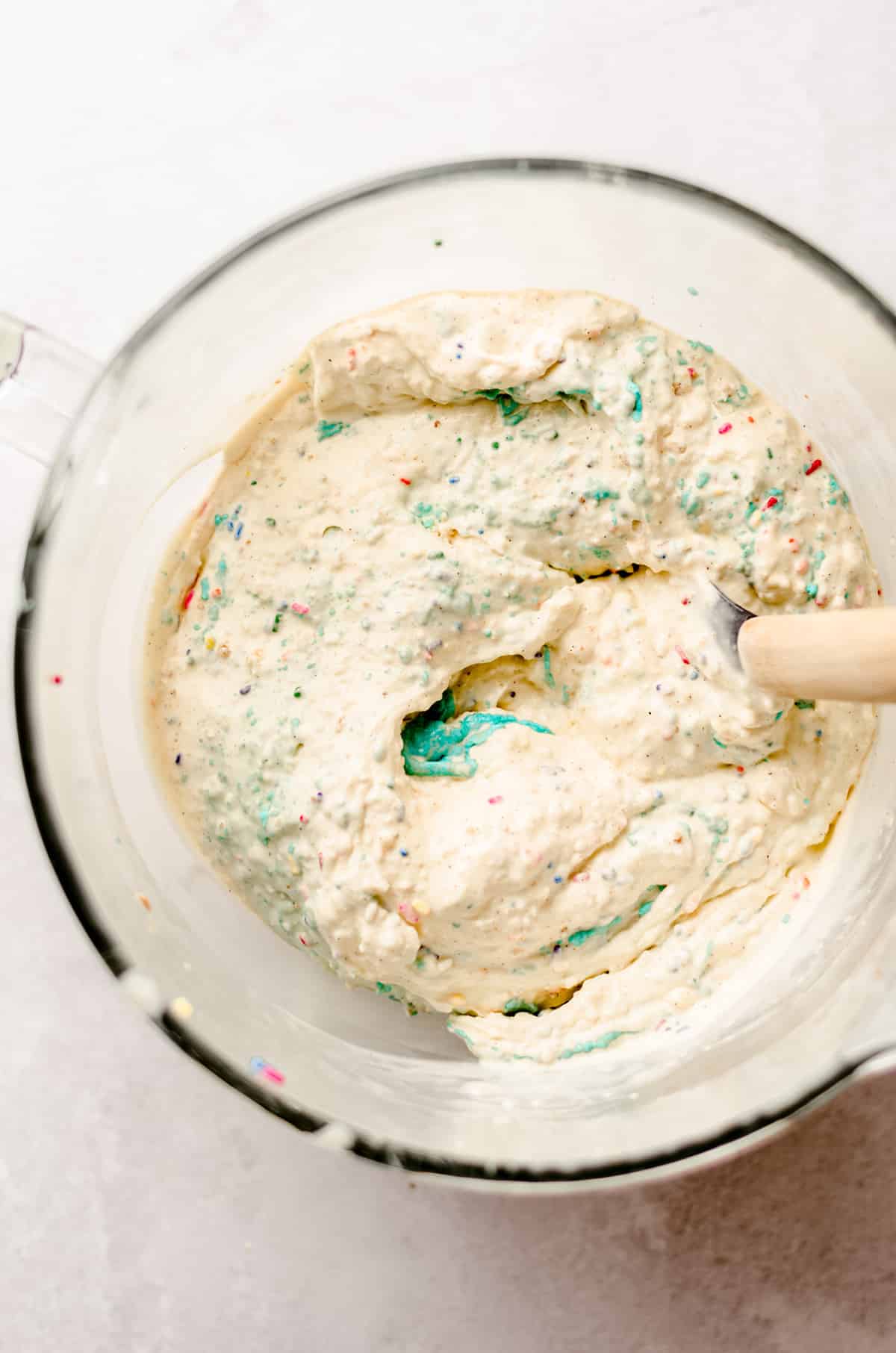 aerial photo of birthday cake ice cream in a glass mixing bowl