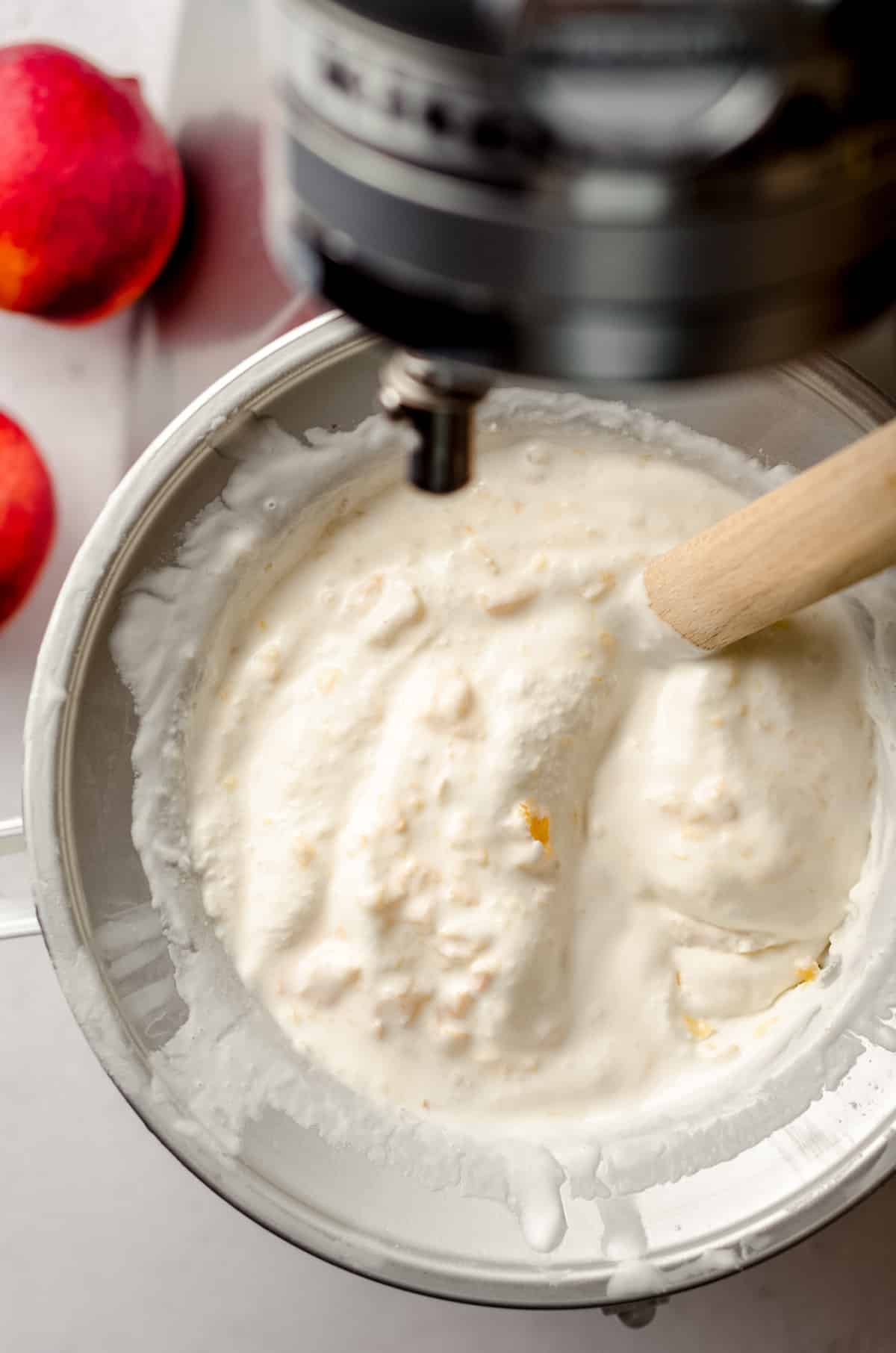 homemade peach ice cream in an ice cream maker