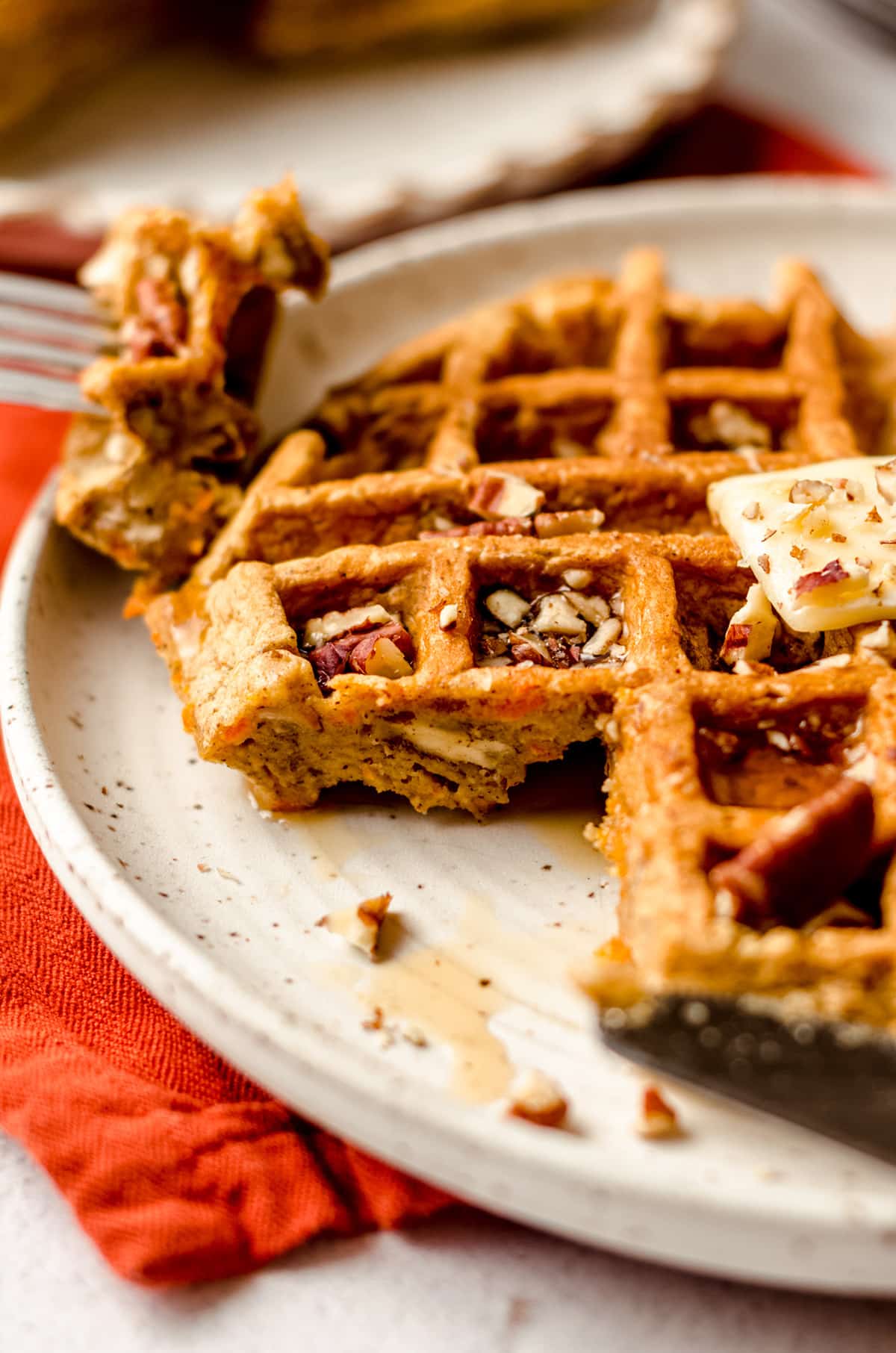 carrot cake waffle with a bite taken out of it