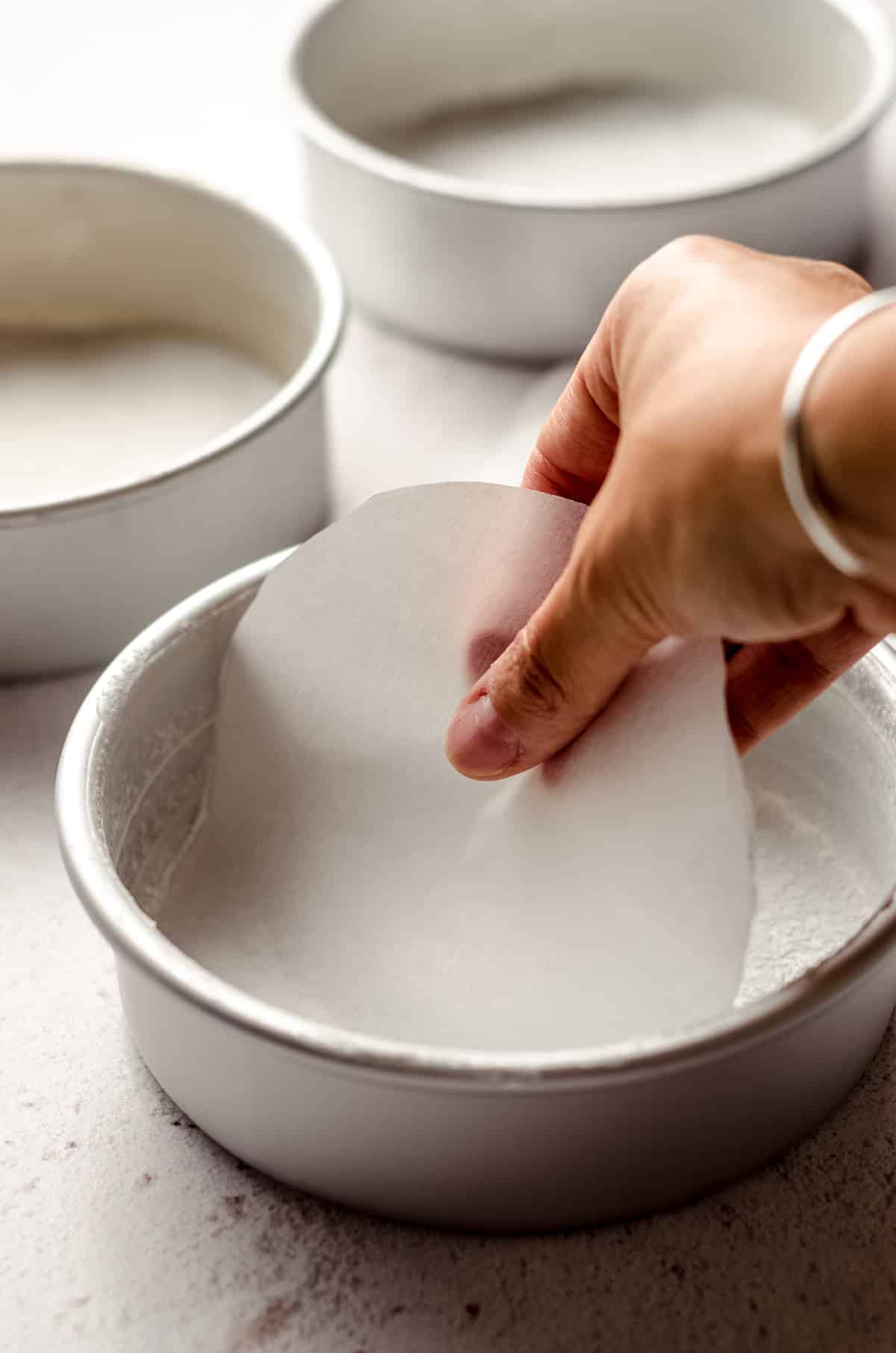 laying a parchment round in a baking pan