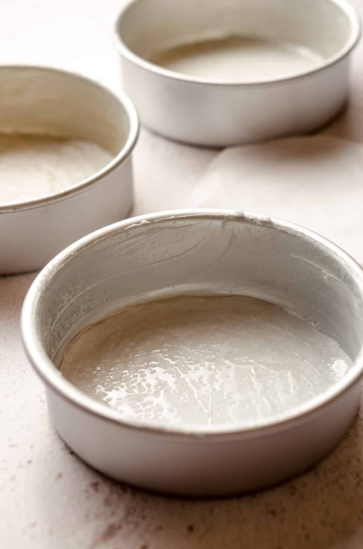 cake pans prepped for batter