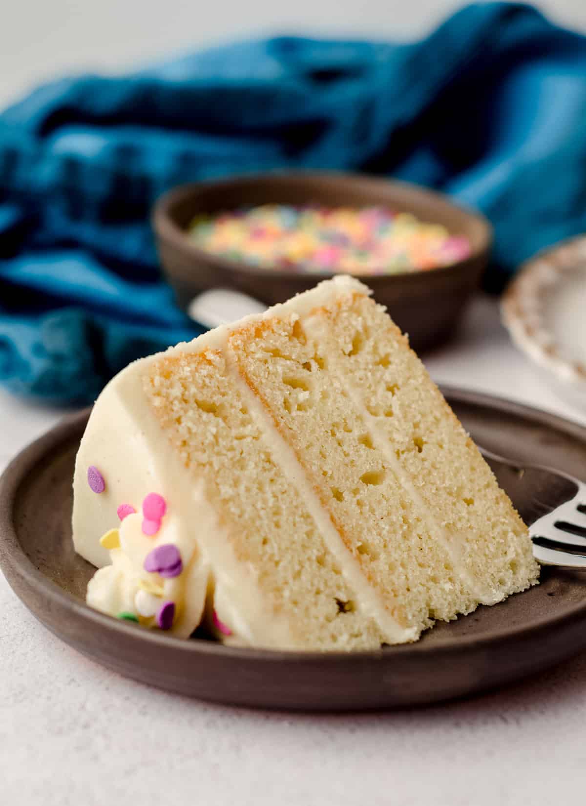 slice of vanilla cake on a plate