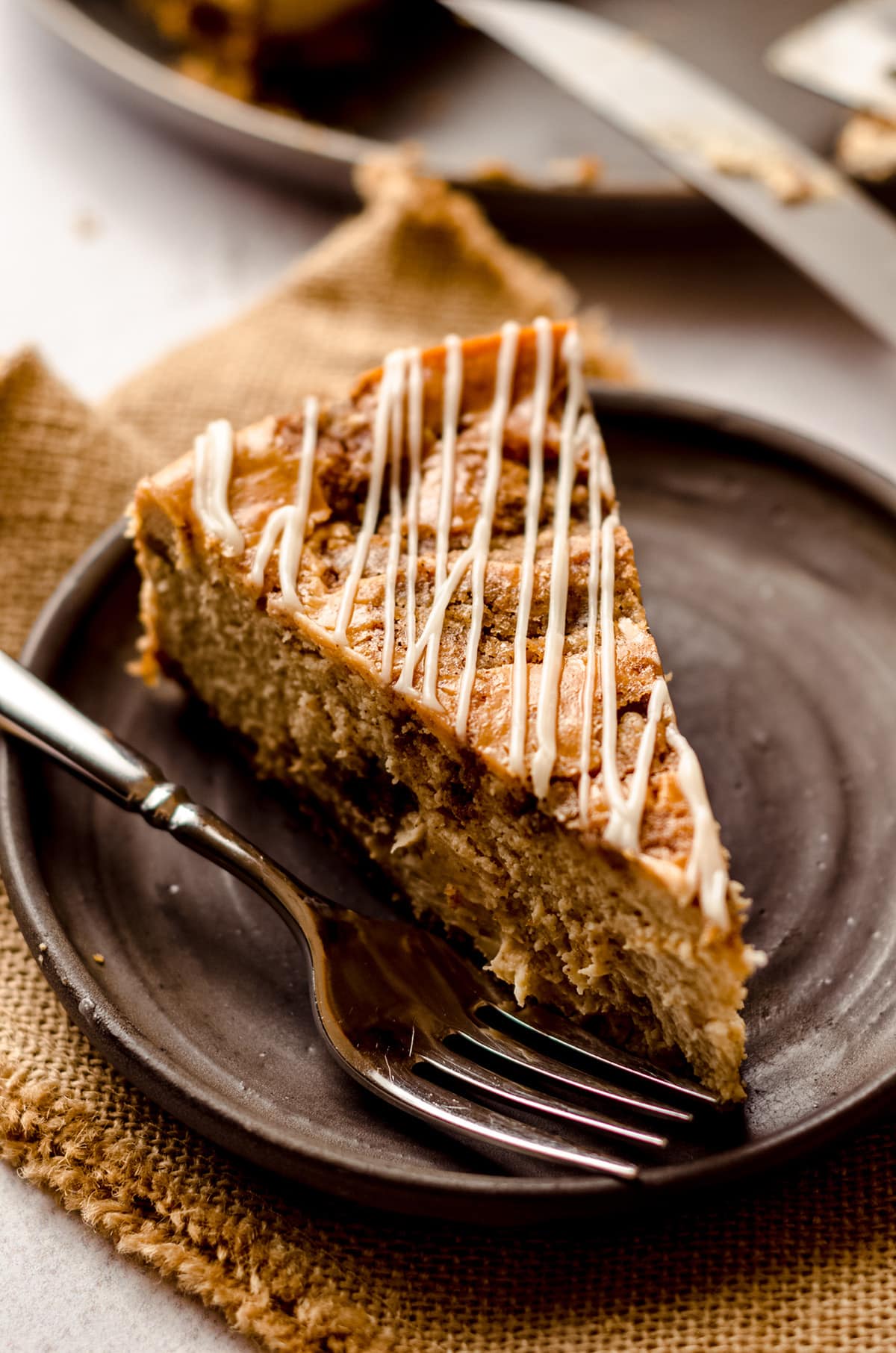 slice of cinnamon roll cheesecake on a plate