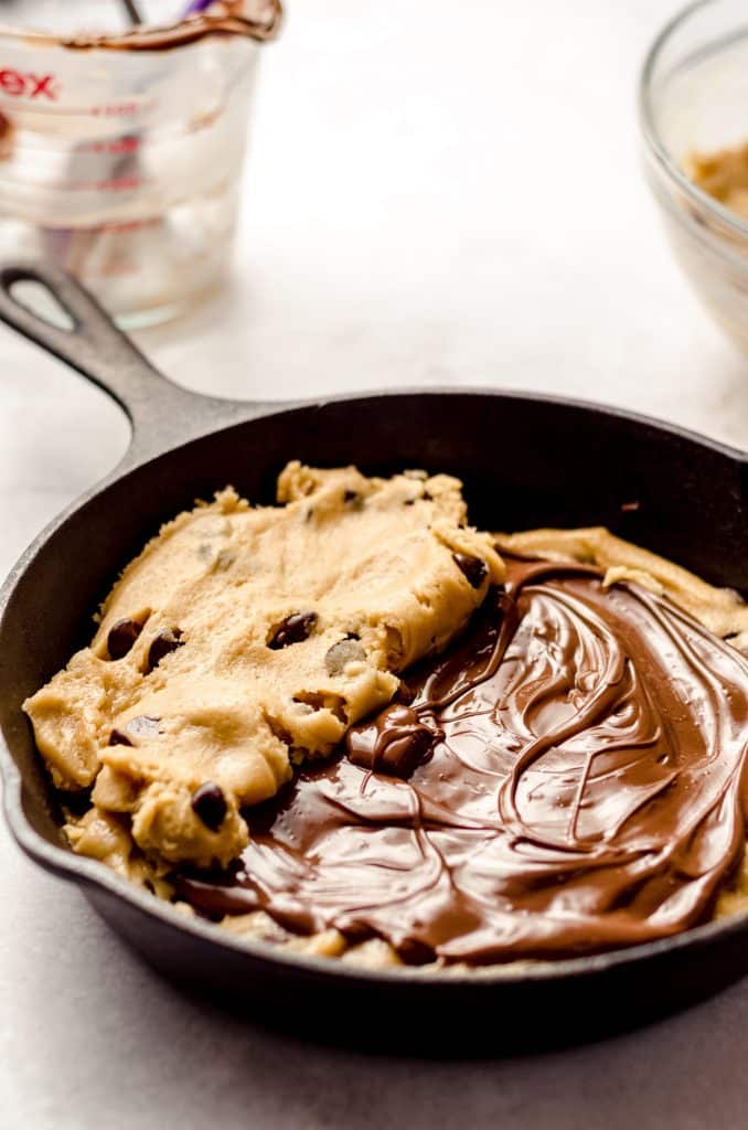 assembling a nutella stuffed cookie cake