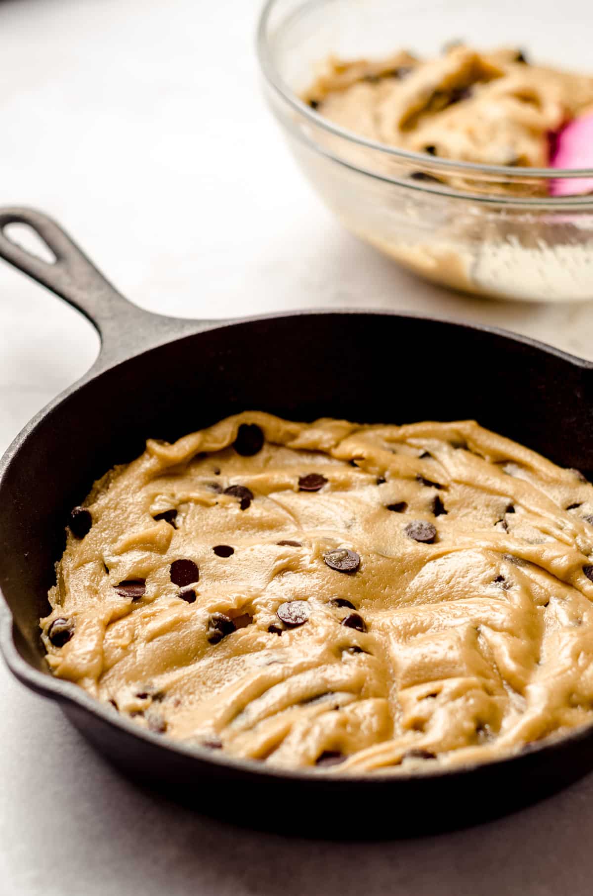 cookie dough pressed into the bottom of a cast iron skillet