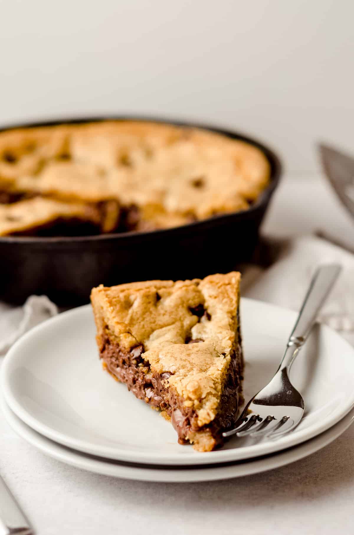 slice of nutella cookie cake on a plate with a fork