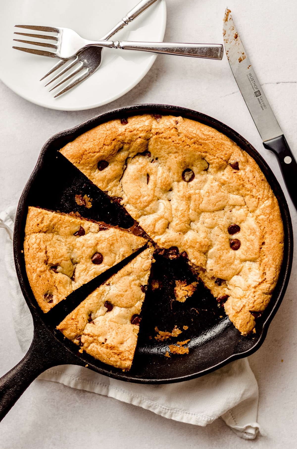 aerial photo of nutella skillet cookie in a cast iron skillet cut into slices