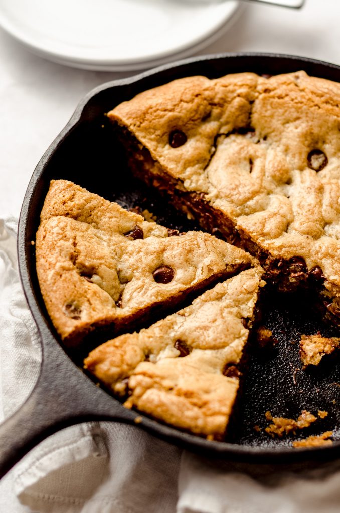 nutella skillet cookie in a cast iron skillet cut into slices