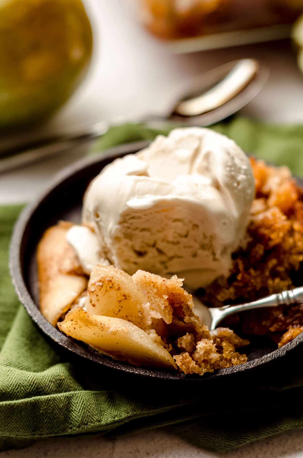 pear cobbler with a scoop of ice cream on top