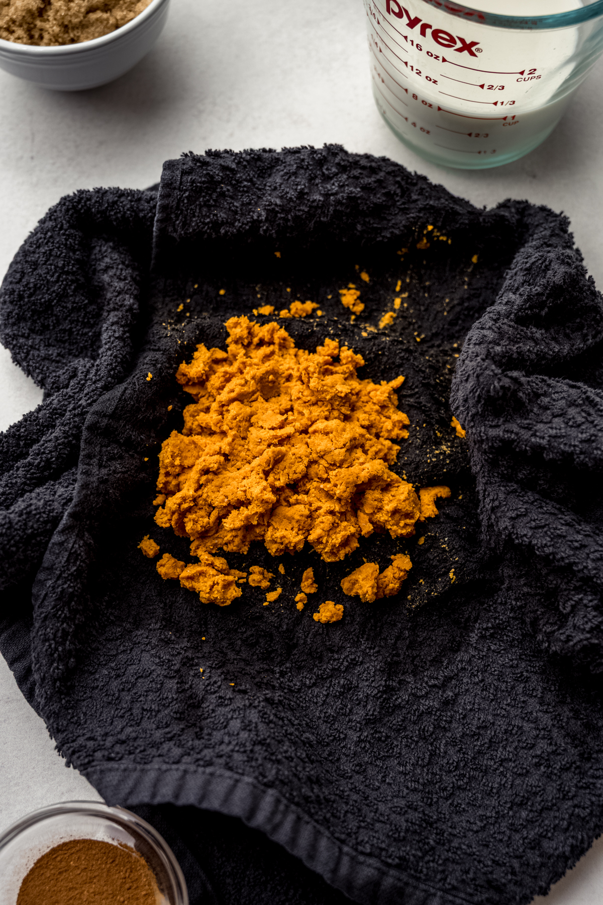 Pumpkin in a kitchen towel that was used to squeeze out the liquid.
