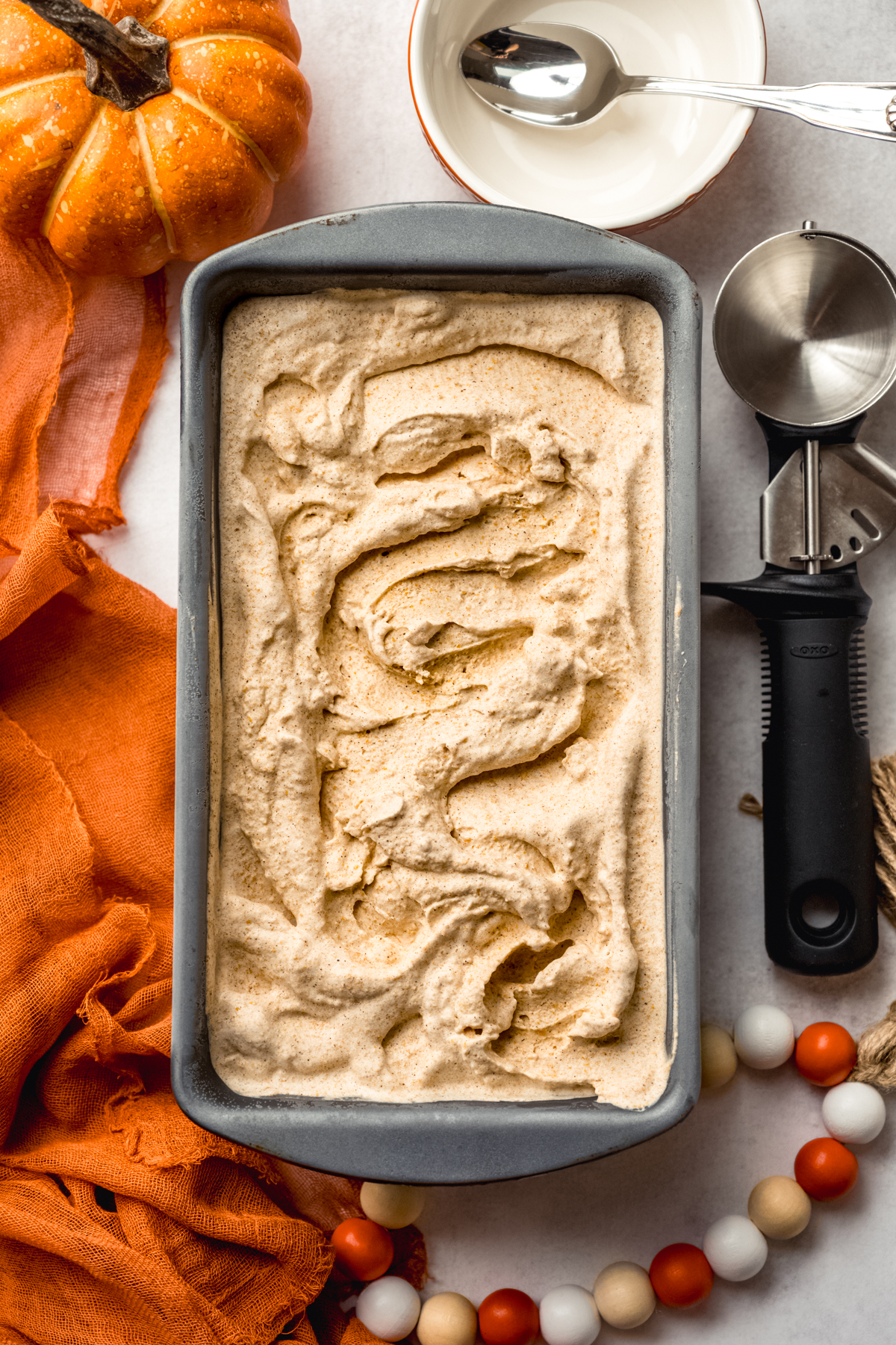 Aerial photo of pumpkin ice cream in a loaf pan. 