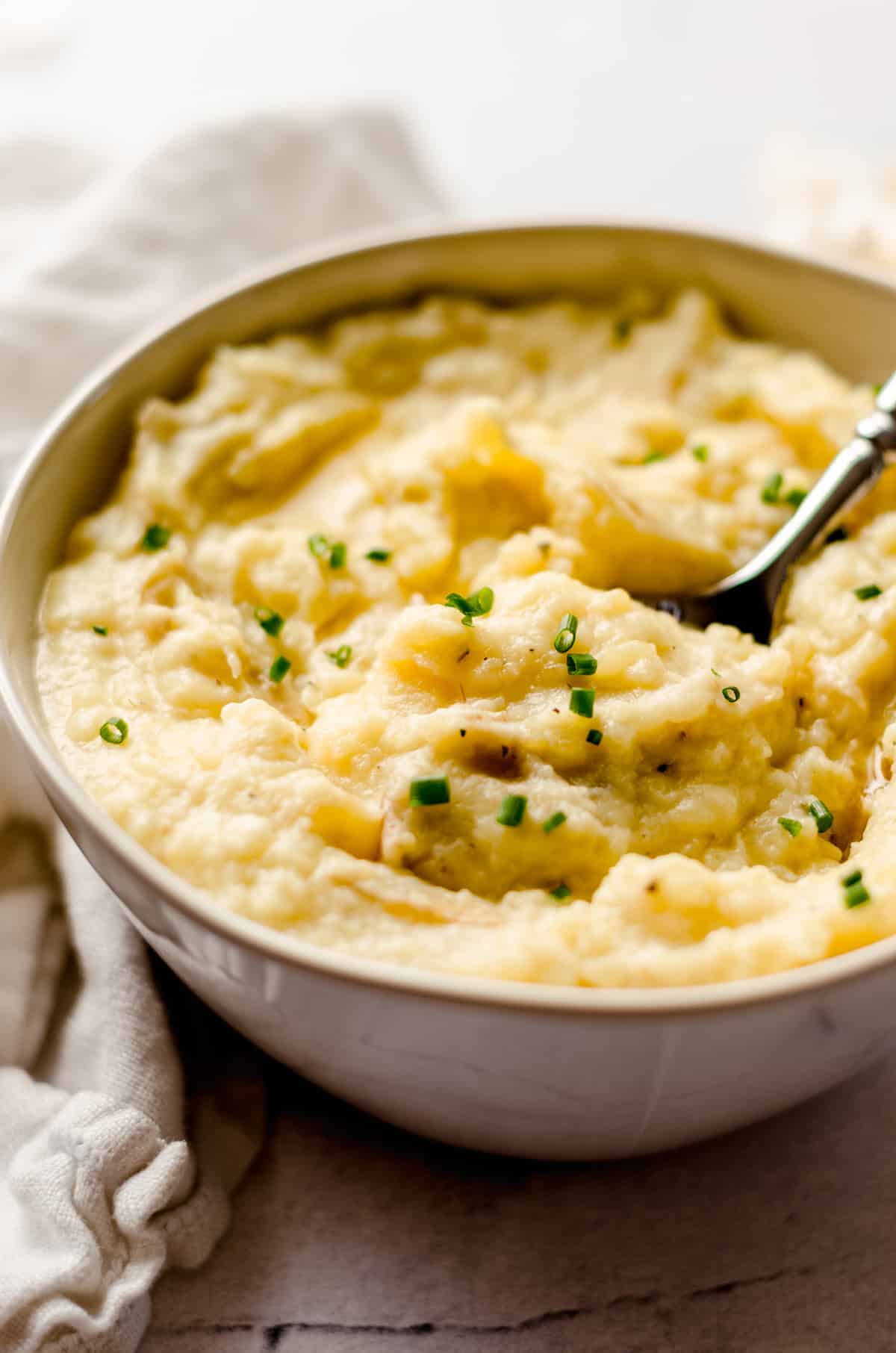 instant pot garlic mashed potatoes in a bowl with a spoon