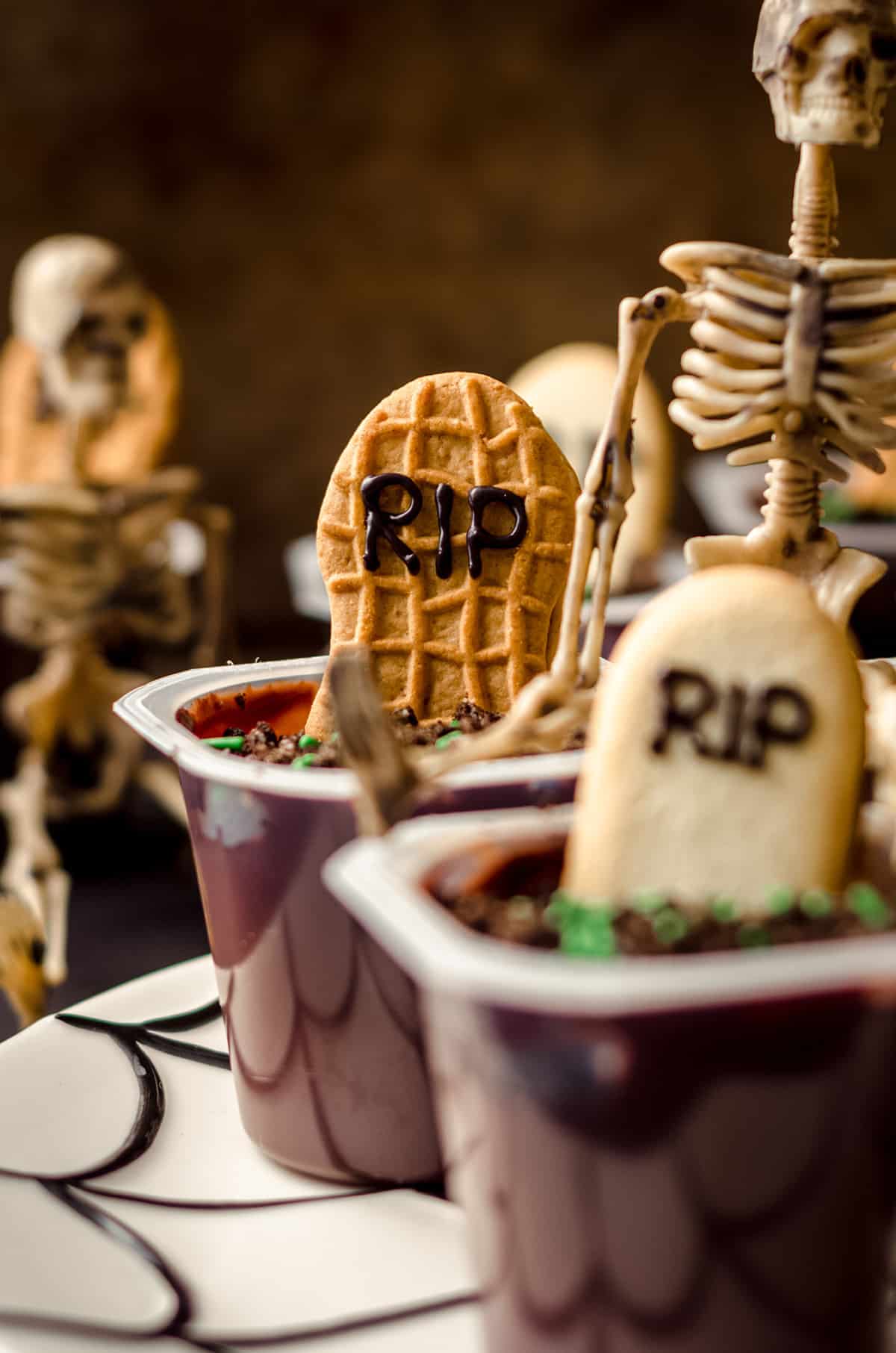 graveyard pudding cup with a skeleton sitting on it