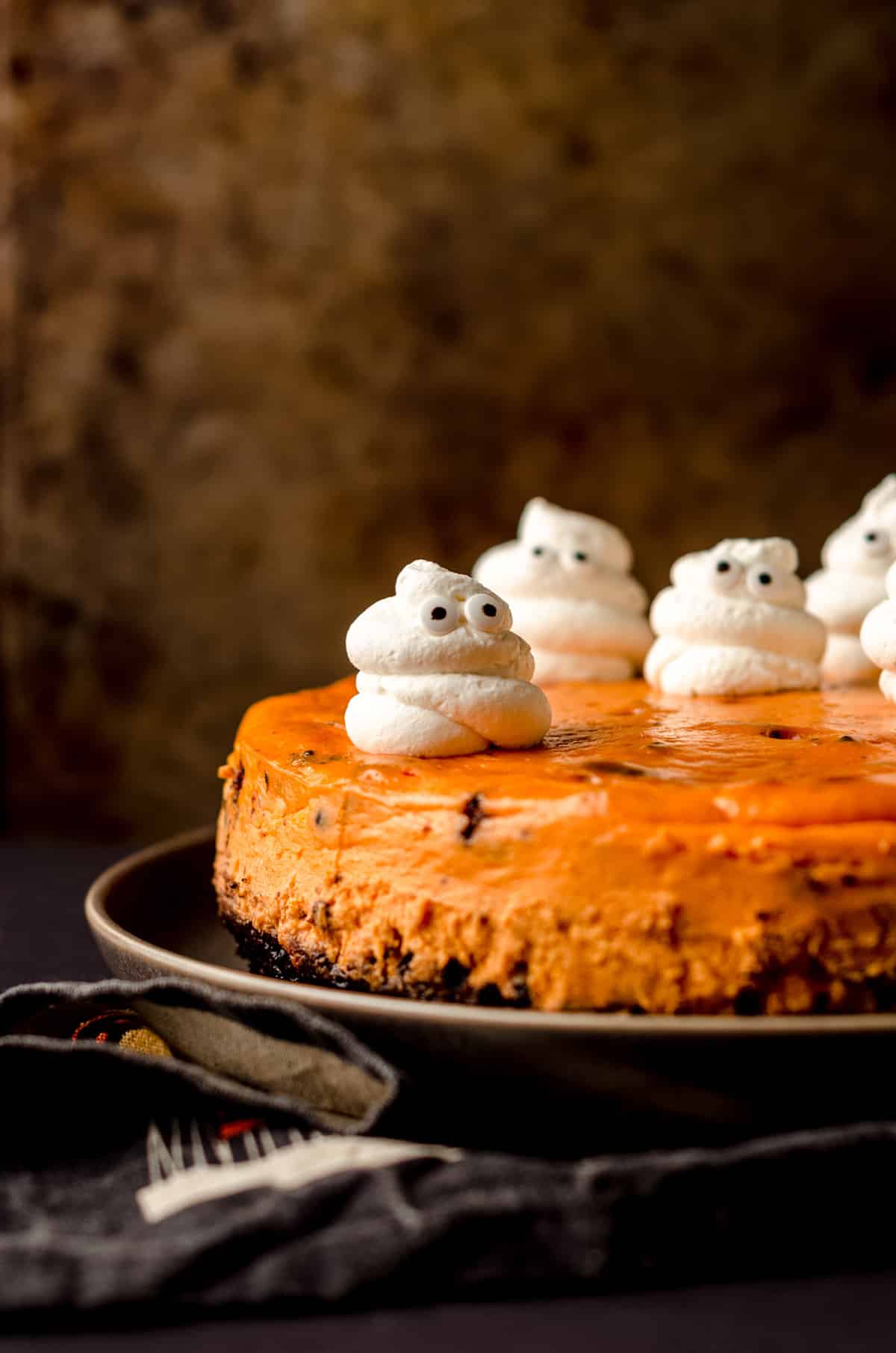 halloween cheesecake with whipped cream ghosts