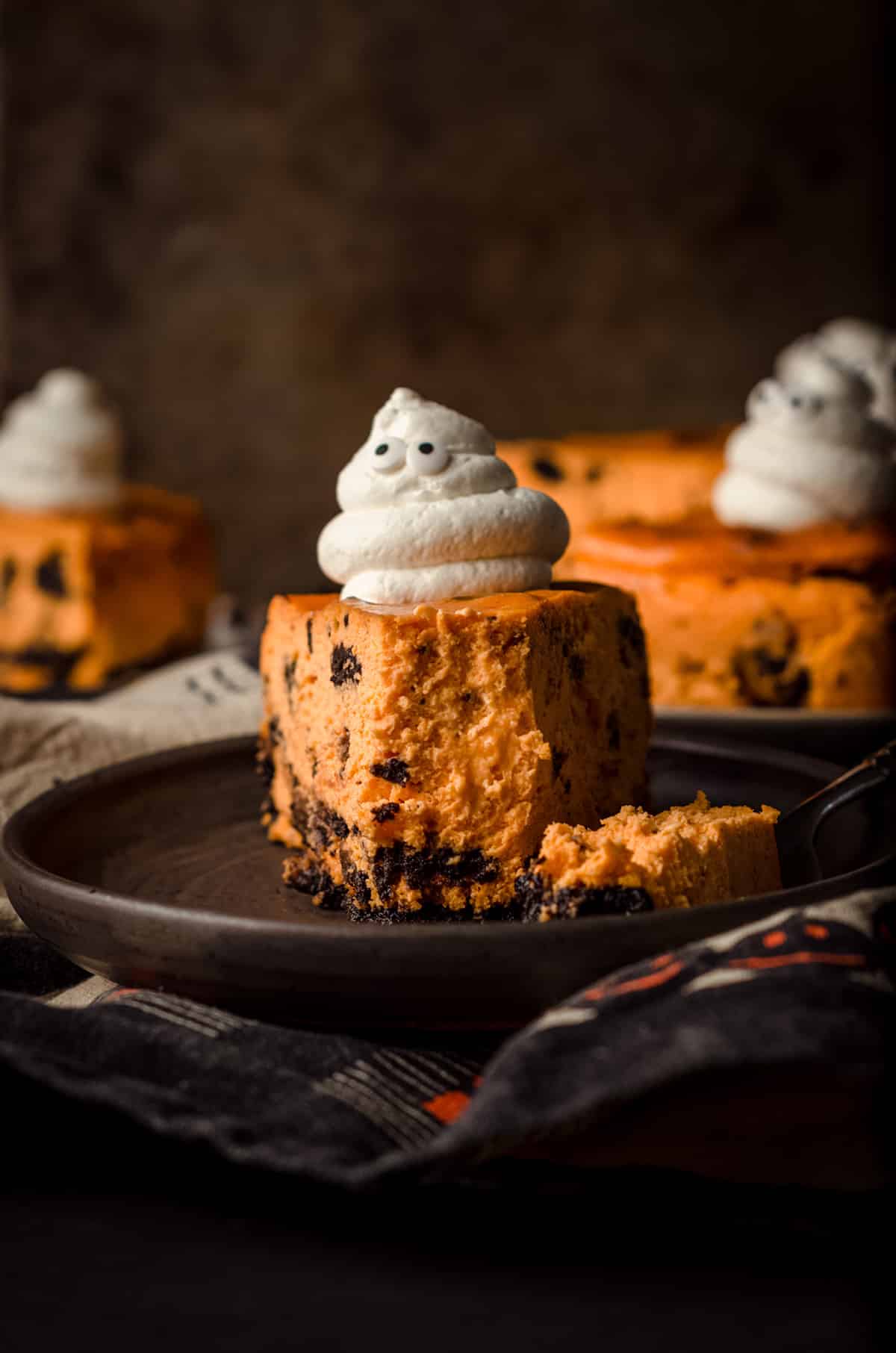halloween cheesecake with a bite taken out of it