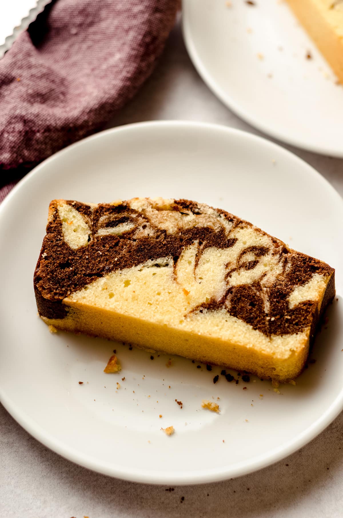 a slice of marbled pound cake on a plate