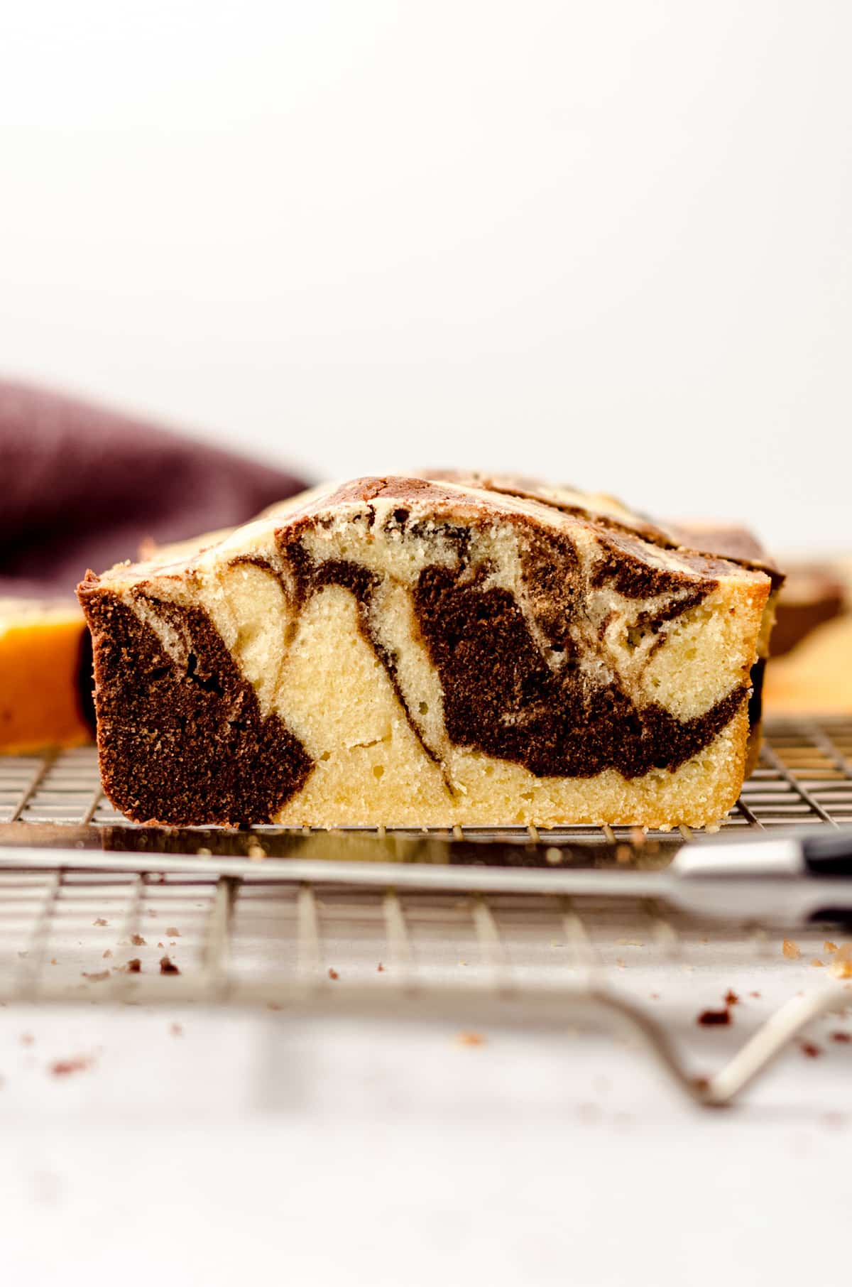 slice of marbled pound cake on a cooling rack