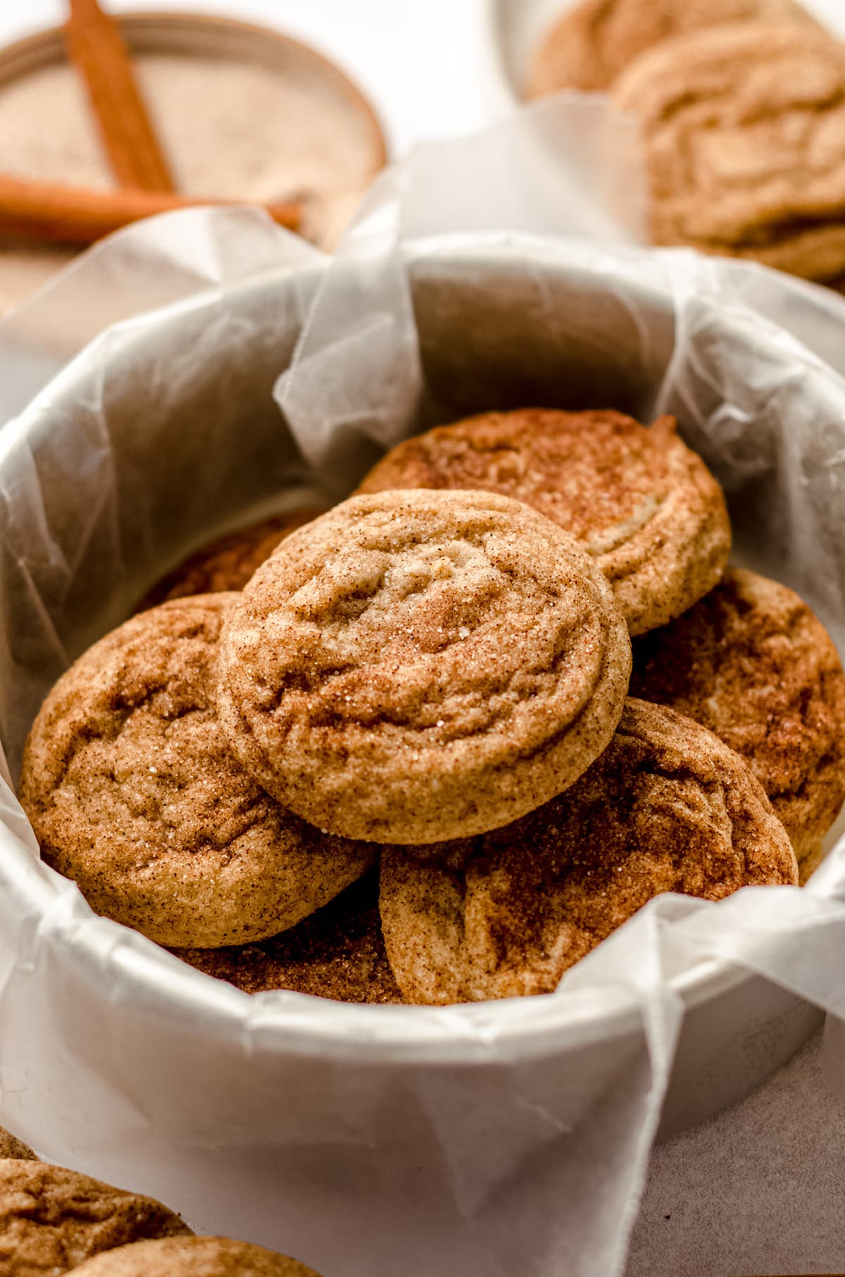 aerial photo of snickerdoodle cookies in a cookie tin