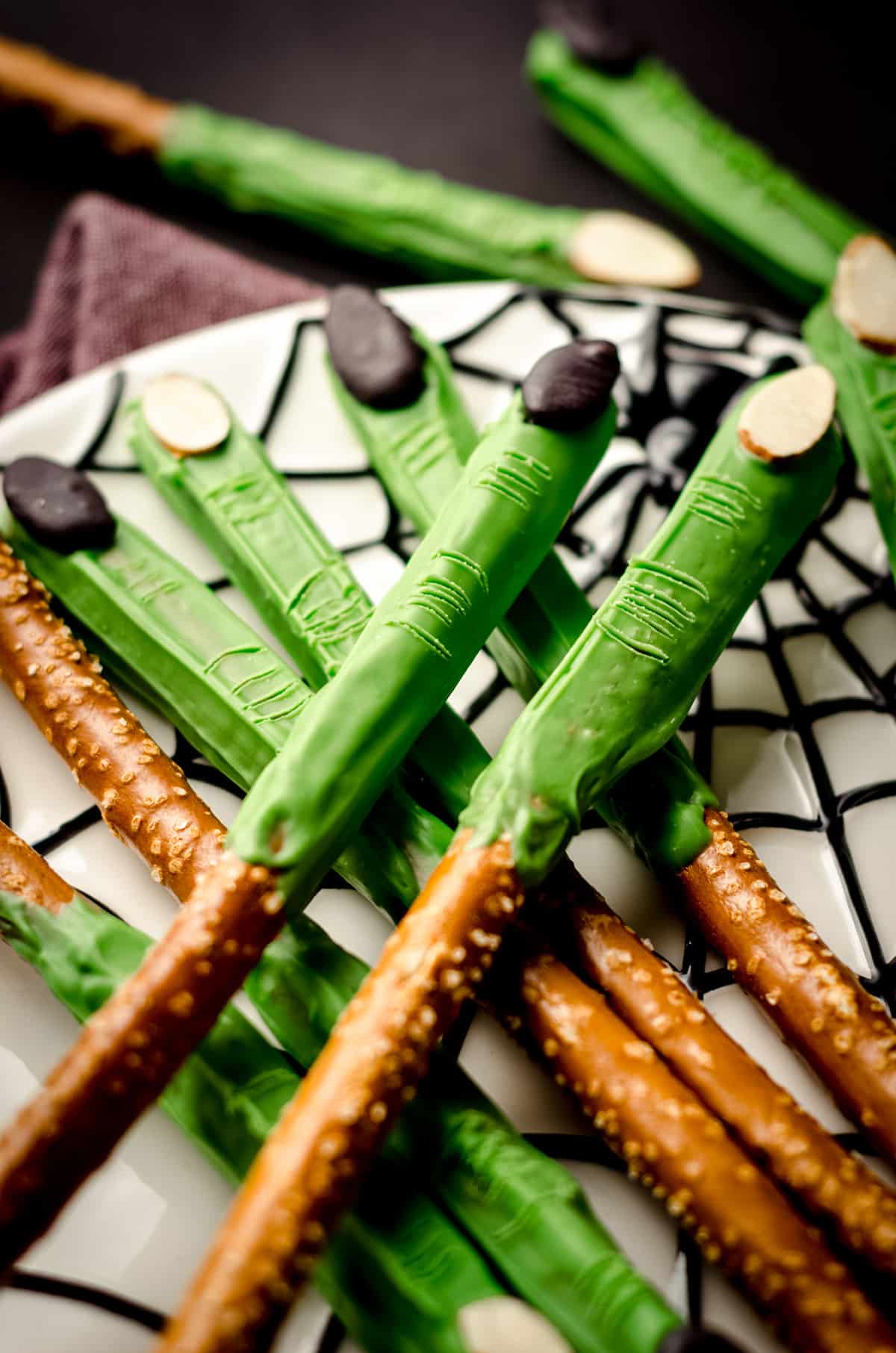 witch finger pretzels on a spider web plate