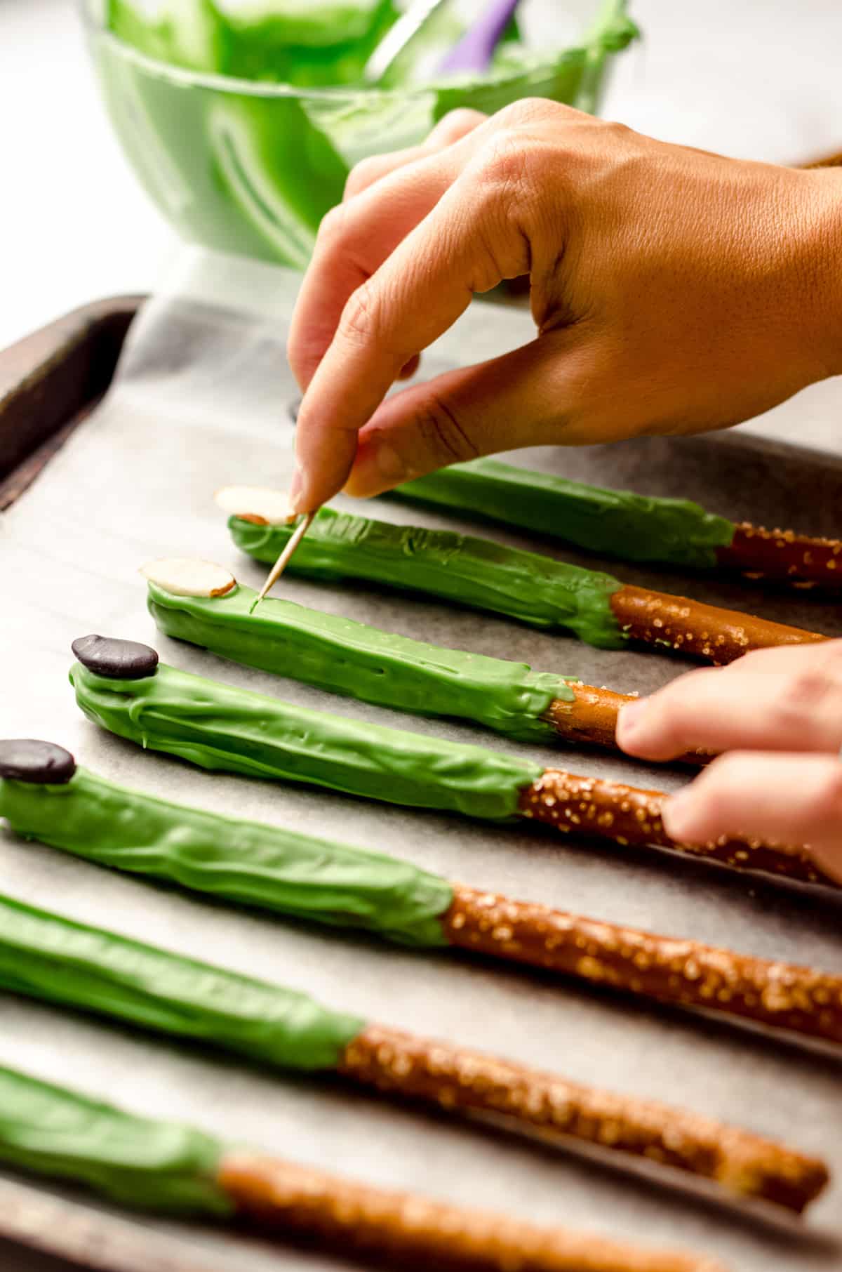 carving knuckle wrinkles into witch finger pretzels