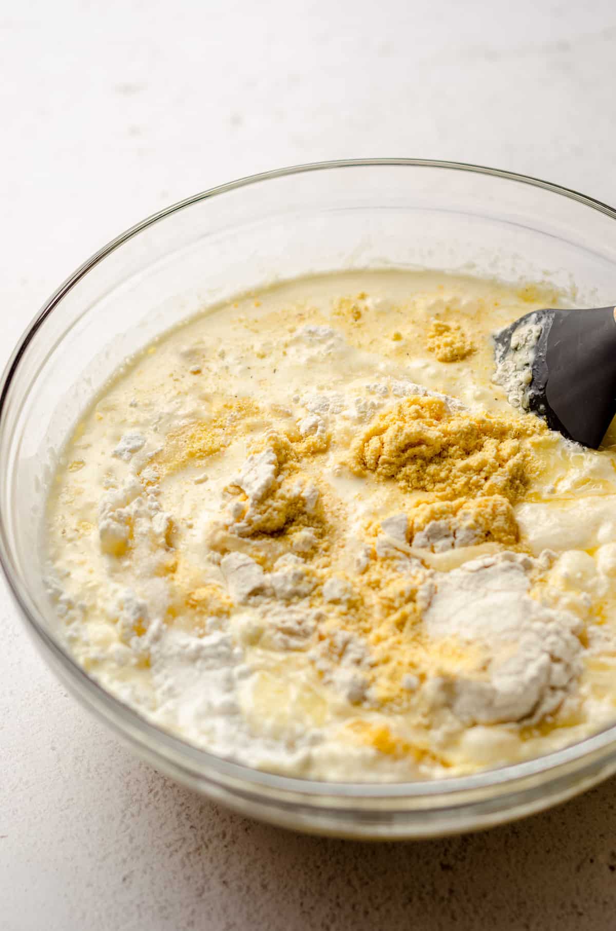 ingredients for homemade cornbread in a glass bowl