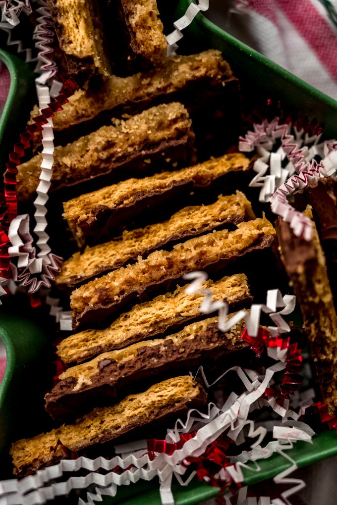 Aerial photo of pieces of graham cracker toffee bark in a tree shaped container.
