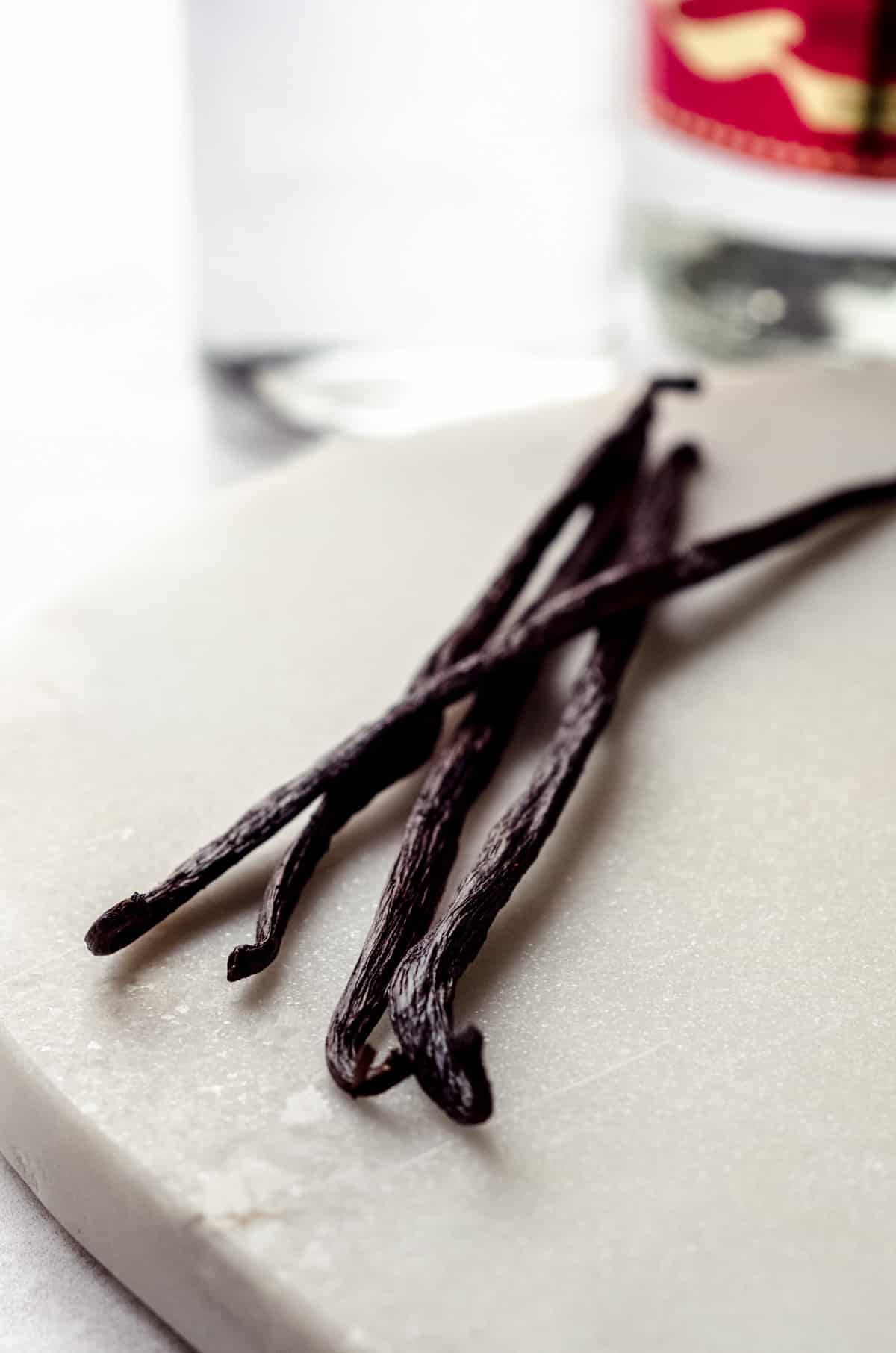 vanilla beans on a marble cutting board