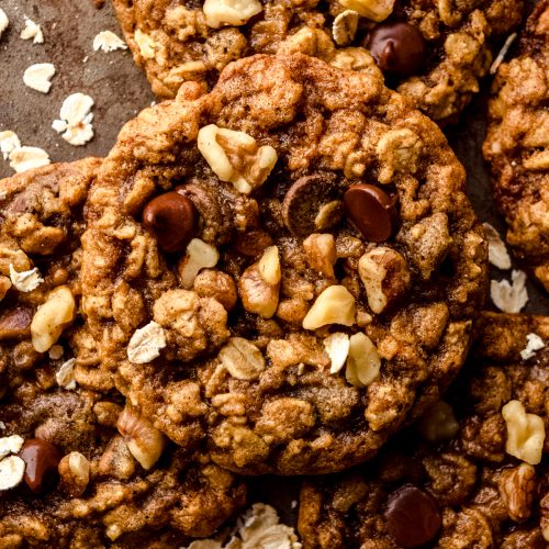 Oatmeal walnut chocolate chip cookies on a surface.