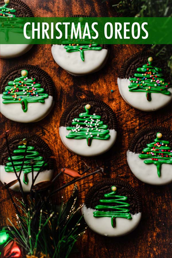 These delightful Christmas Oreos are the perfect holiday treat! Store bought Oreo cookies are dipped into melted white chocolate, decorated with a simple (yet adorable) Christmas tree motif, then sprinkled with colorful nonpareils. via @frshaprilflours