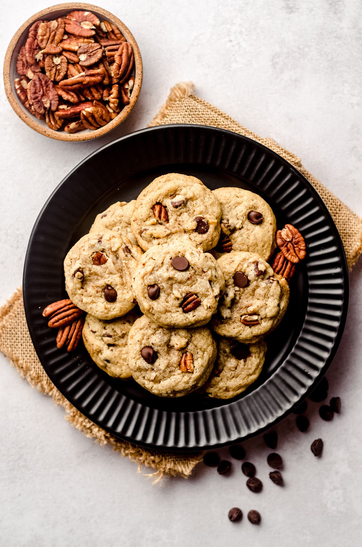 aerial photo of pecan chocolate chip cookies on a plate