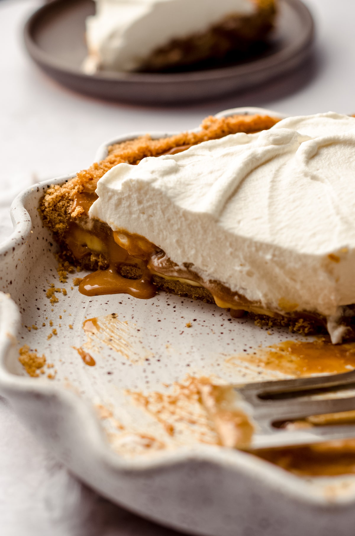 side view of sliced banoffee pie