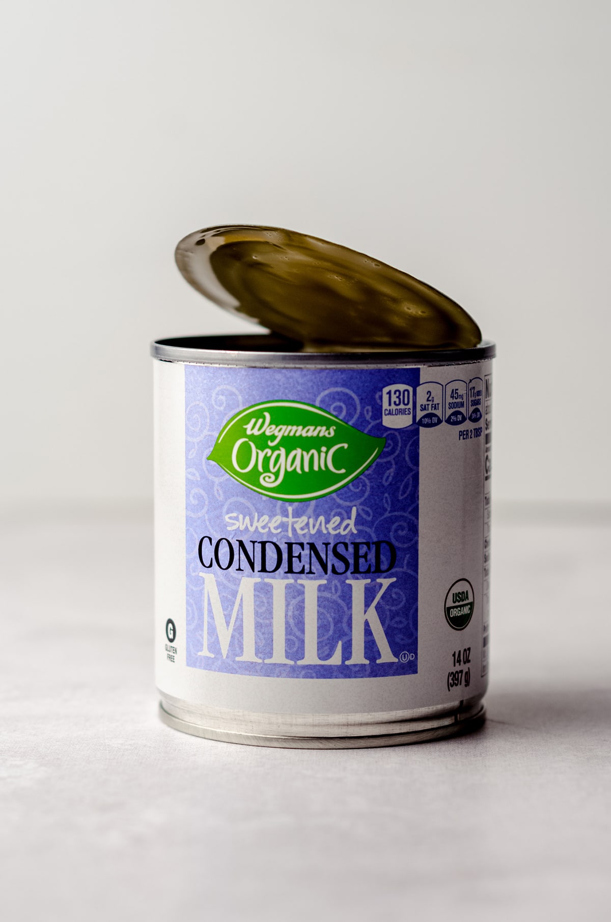 can of sweetened condensed milk with the top open