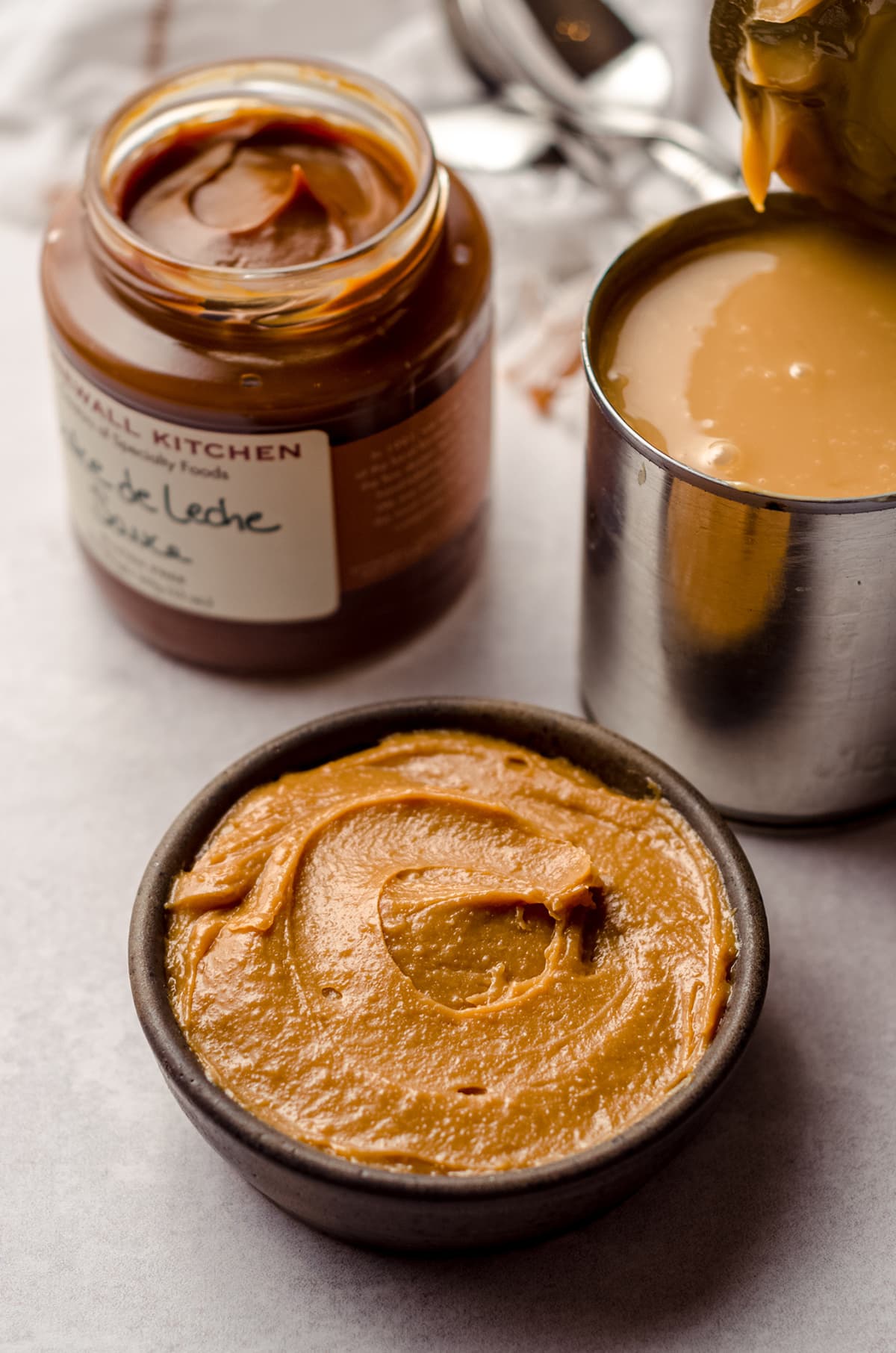 three kinds of dulce de leche-- two homemade and one store-bought-- all are different colors and textures