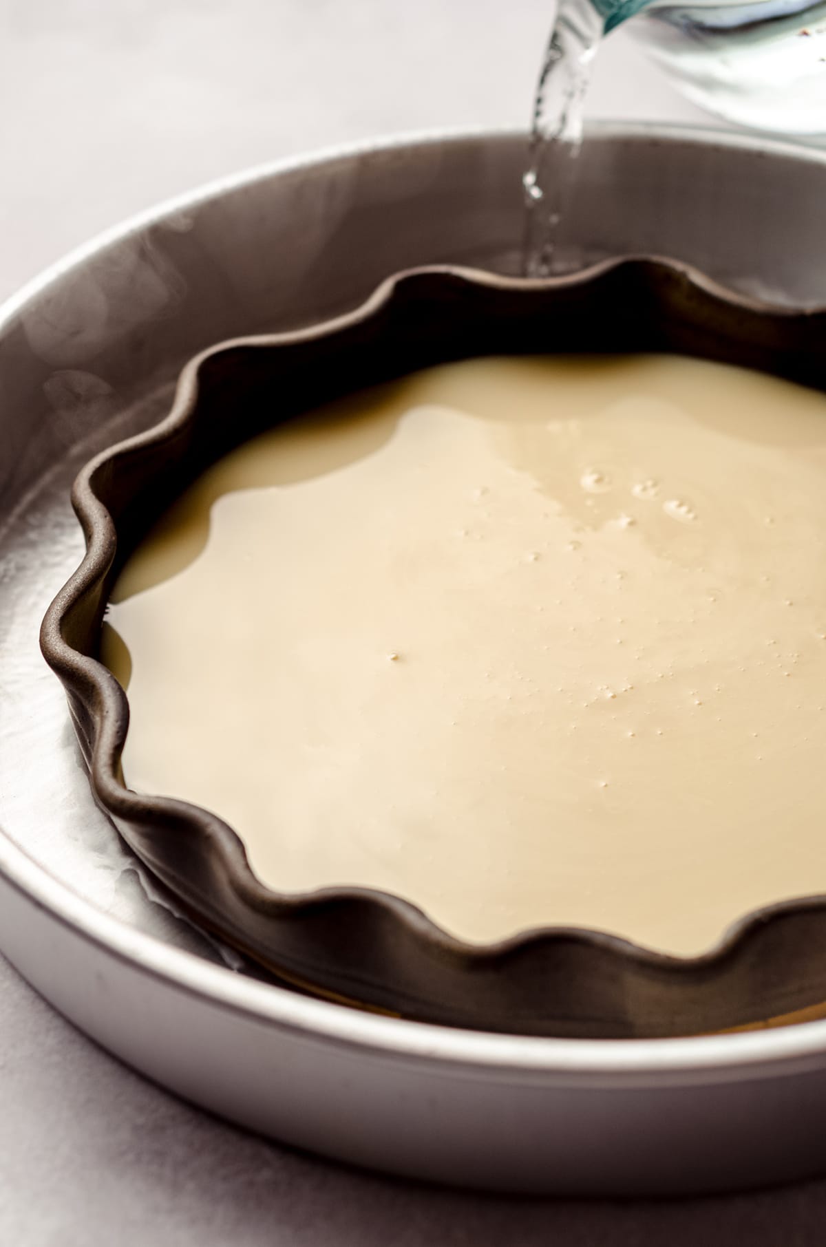 sweetened condensed milk in a pie plate to make dulce de leche