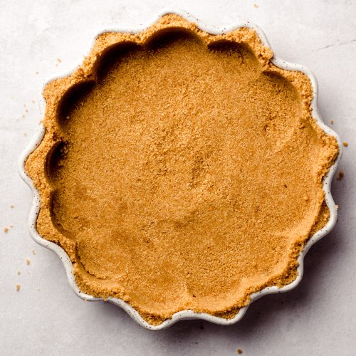 aerial photo of graham cracker crust in a pie plate