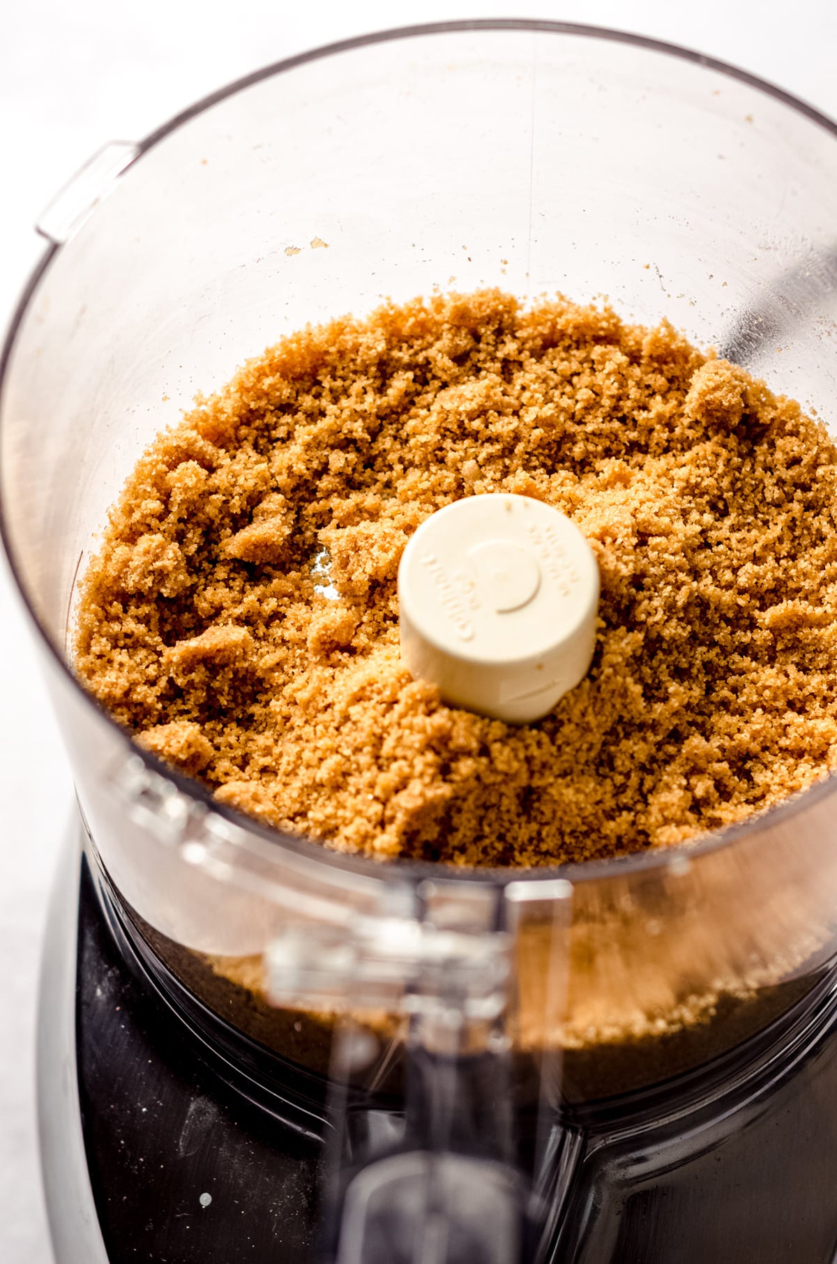 graham cracker crust mixture in a food processor