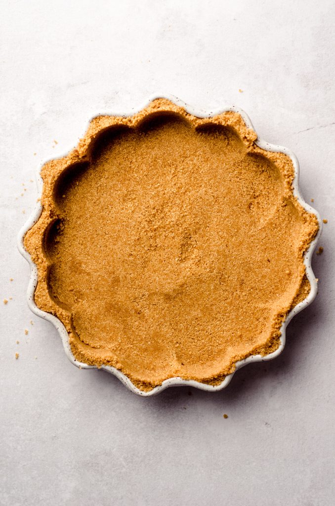 aerial photo of graham cracker crust in a pie plate