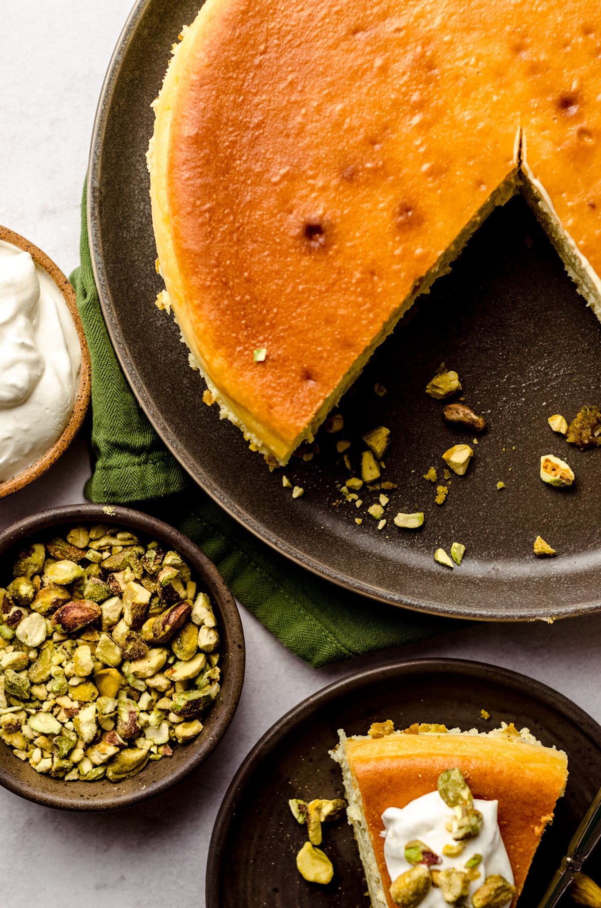 aerial photo of sliced pistachio cheesecake on a platter