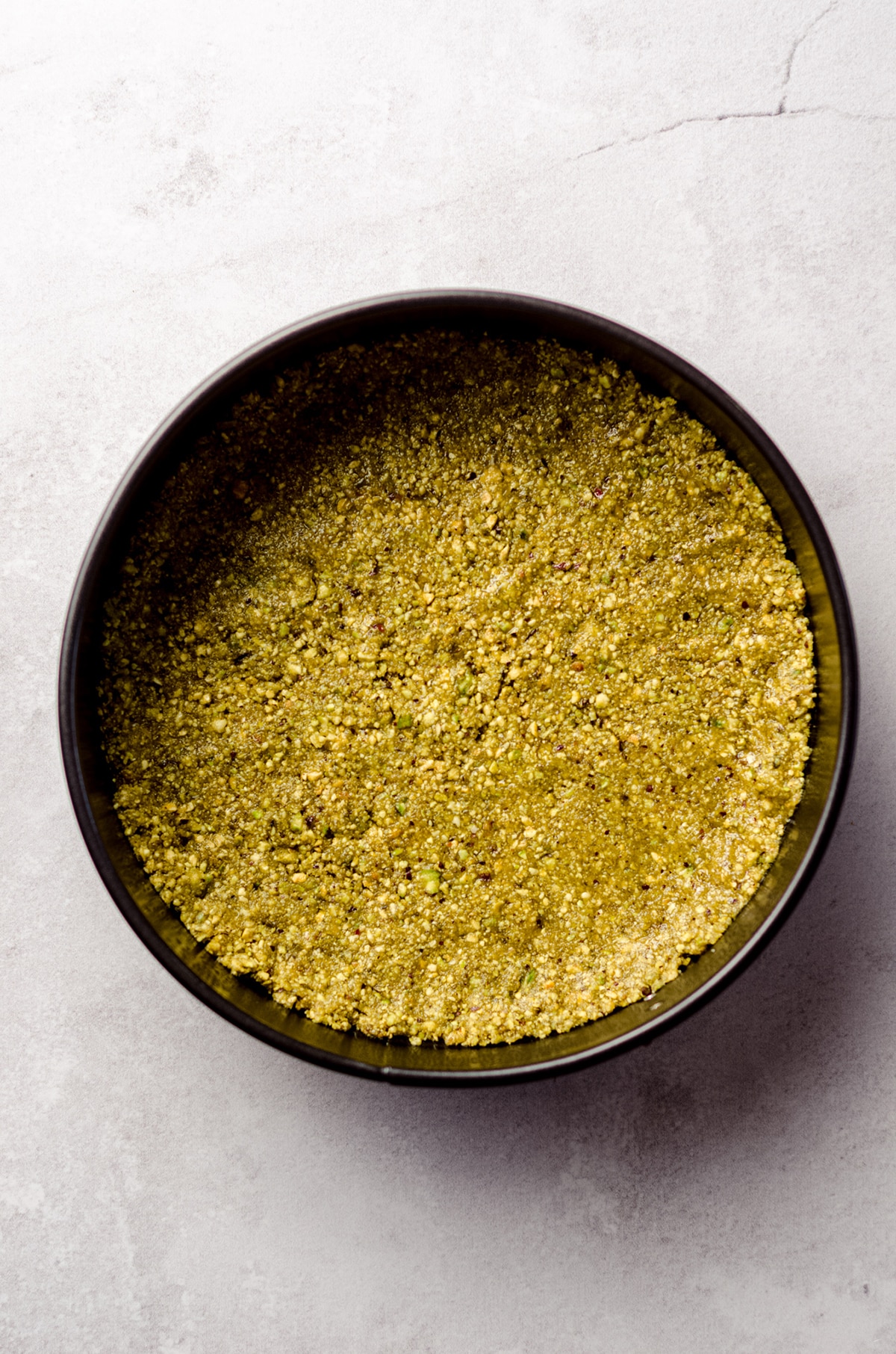 pistachio crust in a springform pan