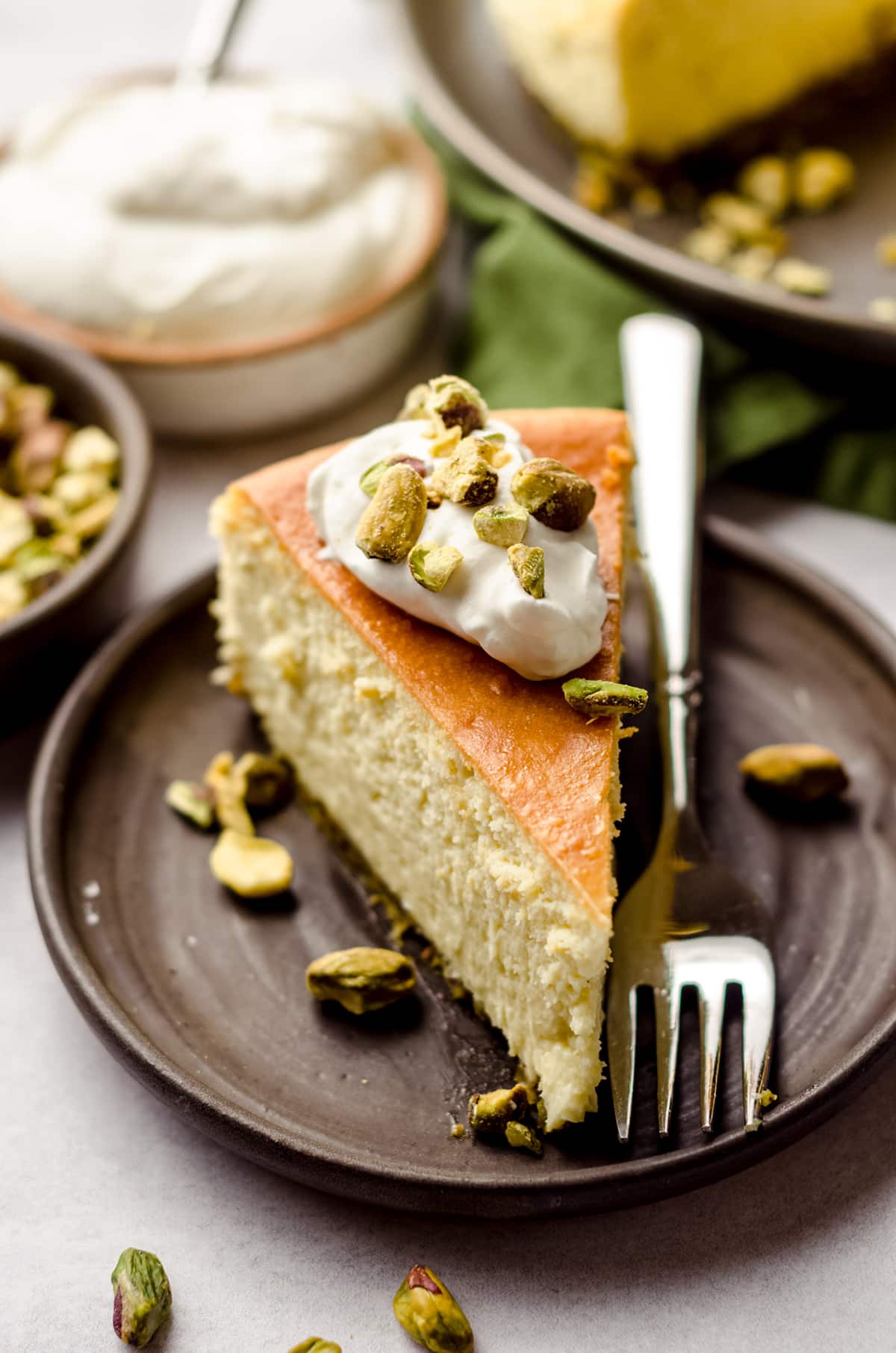 slice of pistachio cheesecake on a plate