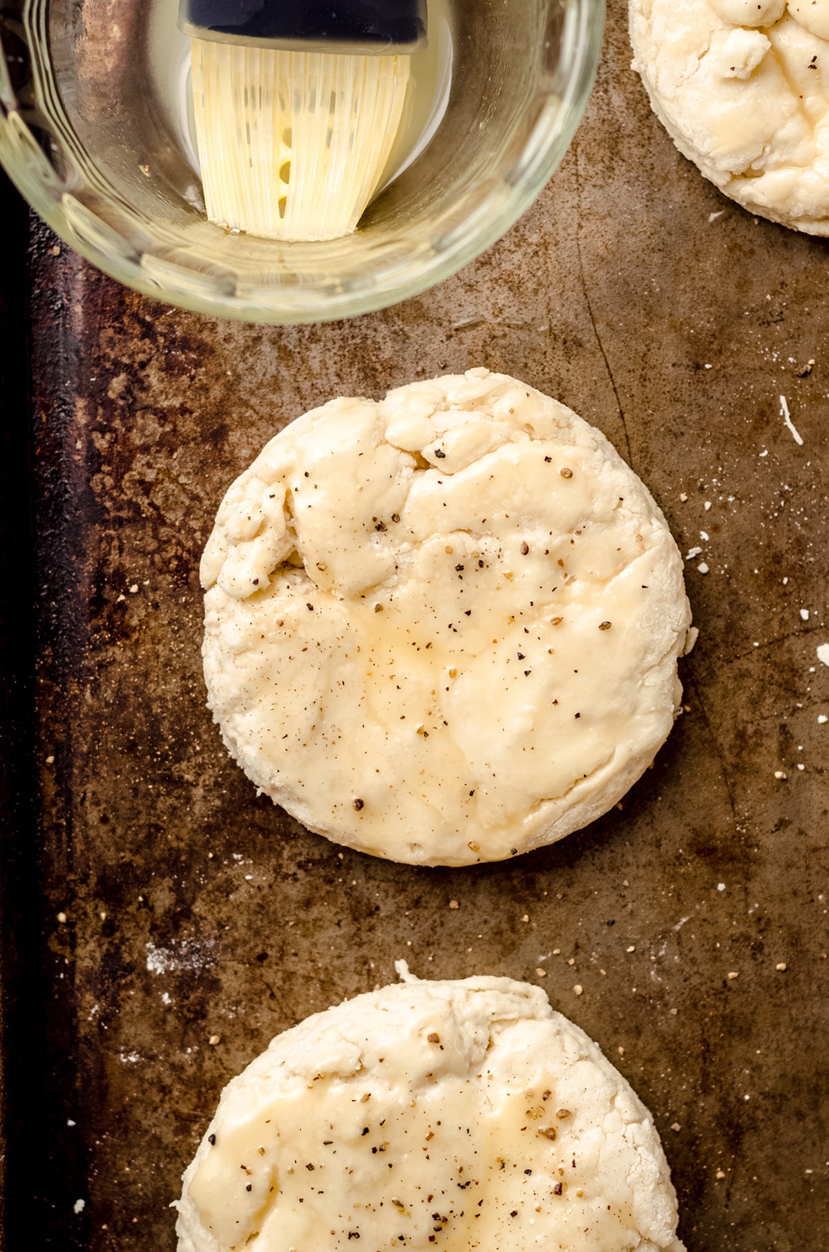 buttermilk biscuits brushed with butter before baking