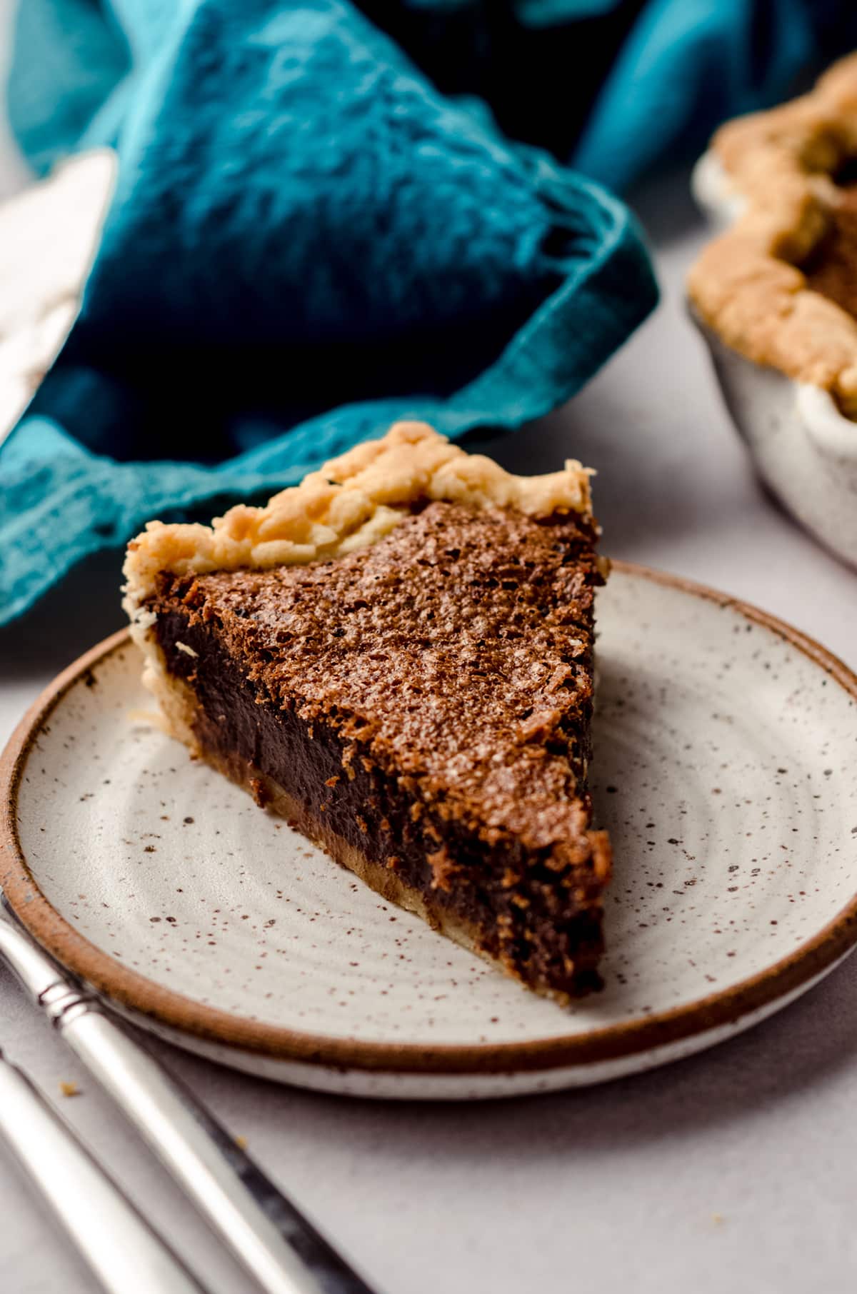 slice of chocolate chess pie on a palte