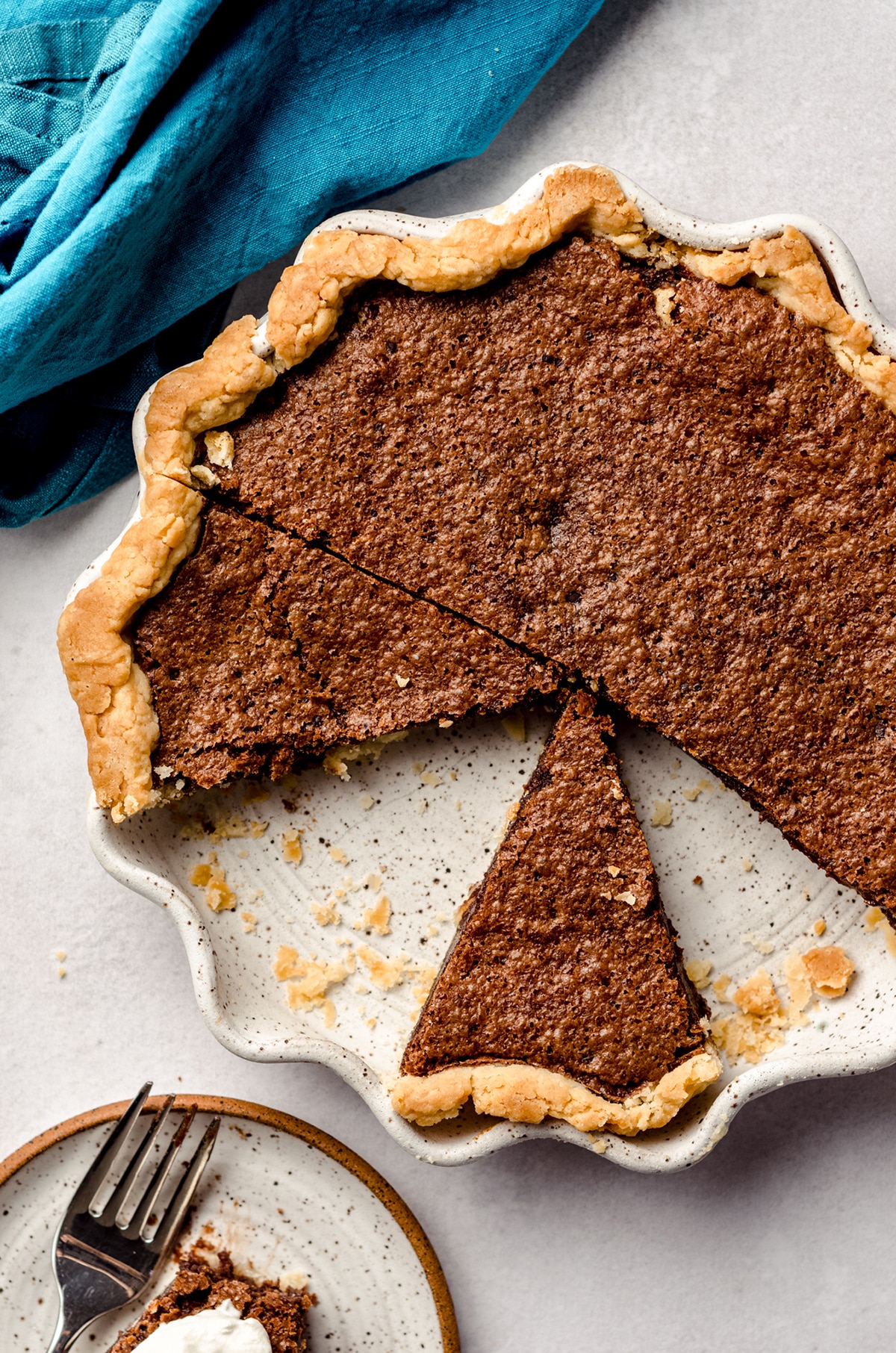 aerial photo of sliced chocolate chess pie in a pie plate
