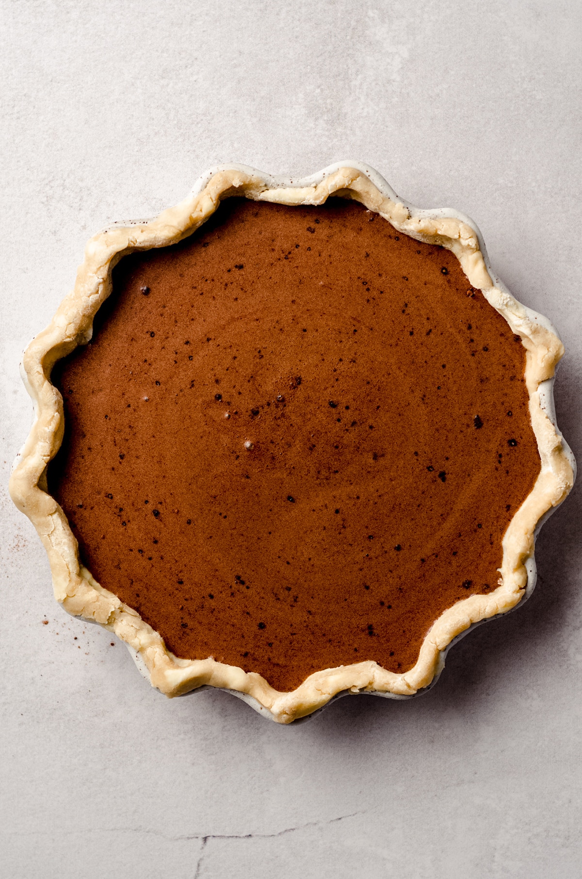 chocolate chess pie batter in a pie plate
