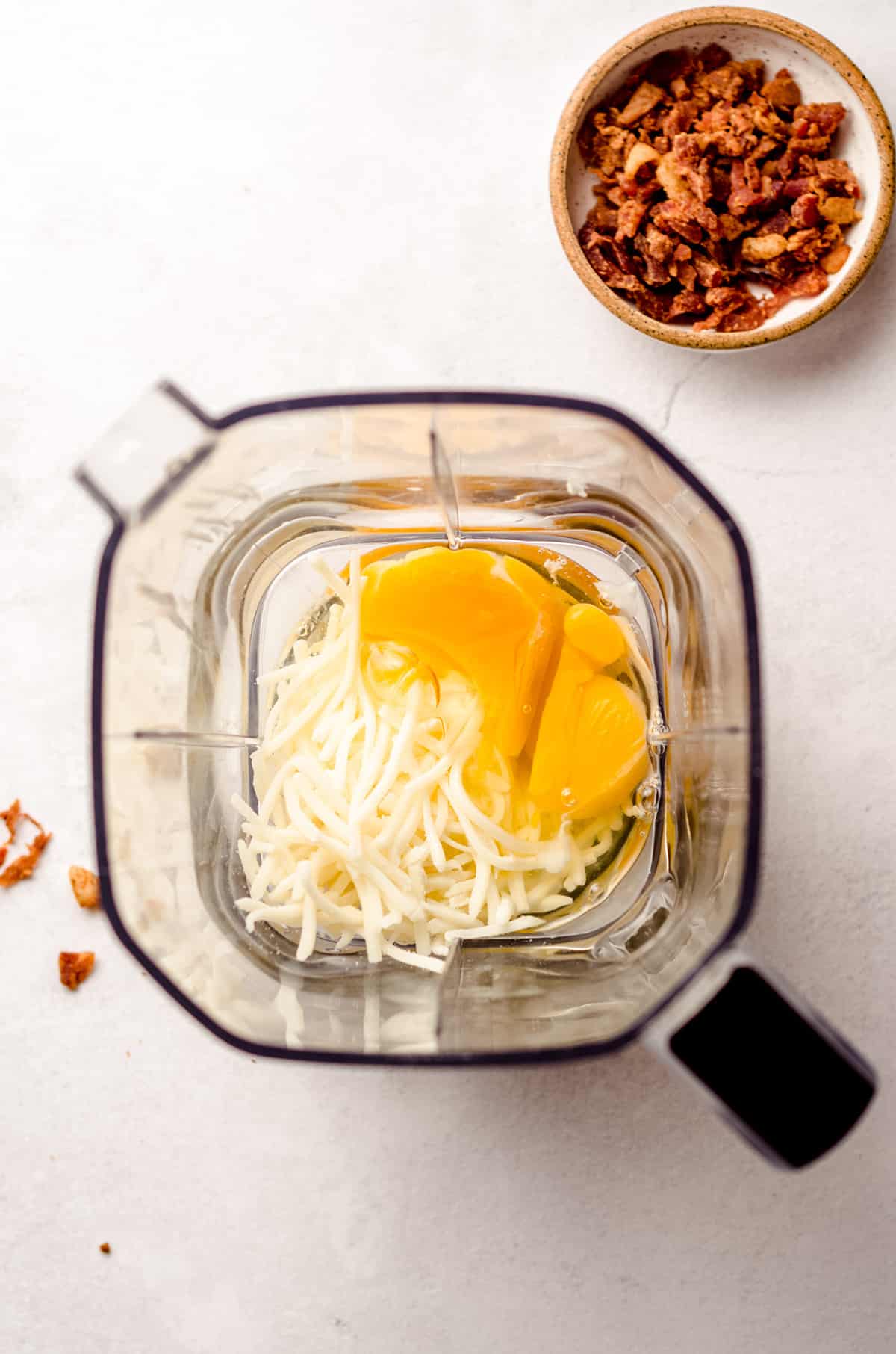 aerial photo of eggs and cheese in a blender to make egg bites