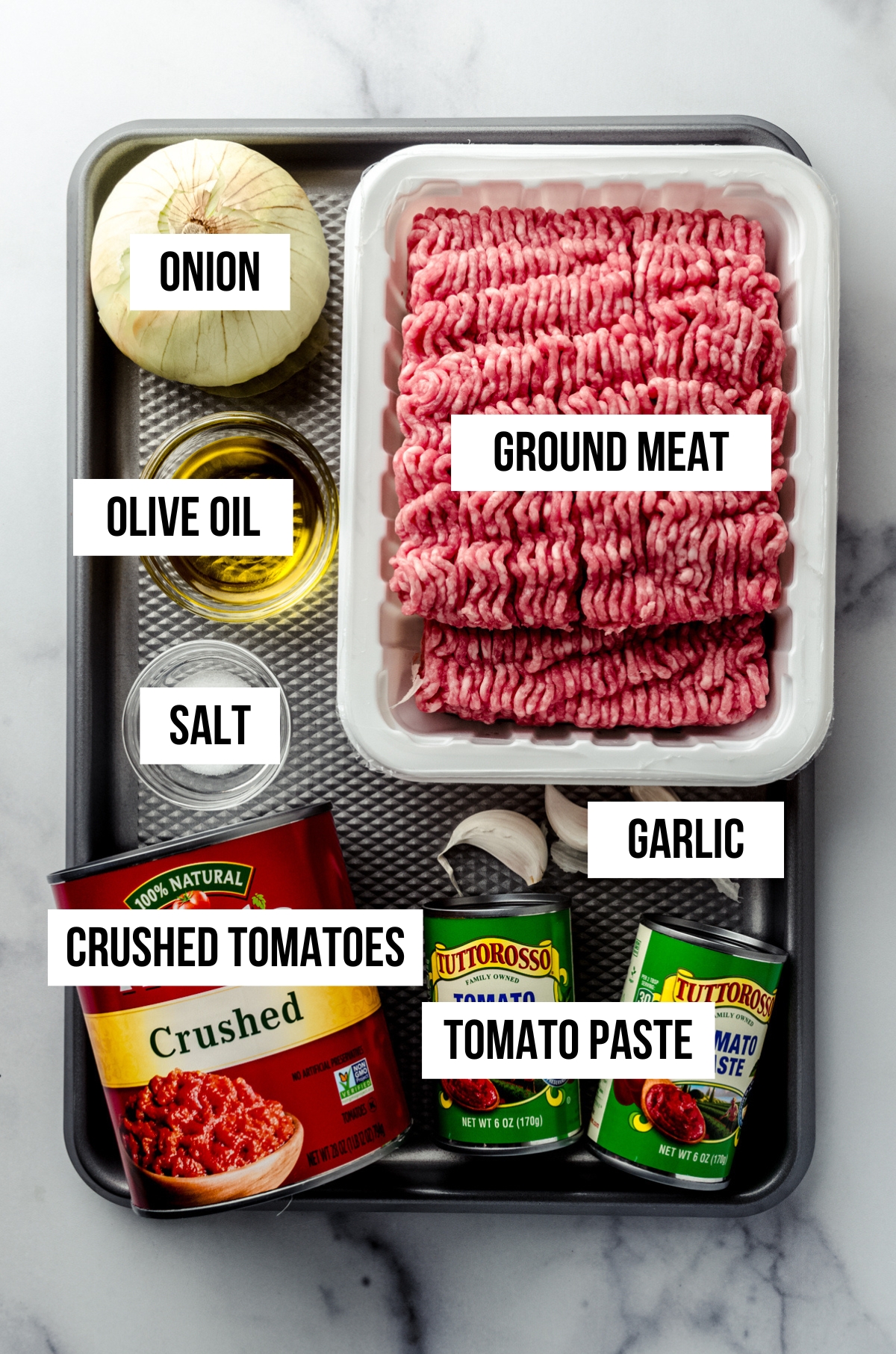 Aerial photo of ingredients for homemade meat sauce with text overlay.