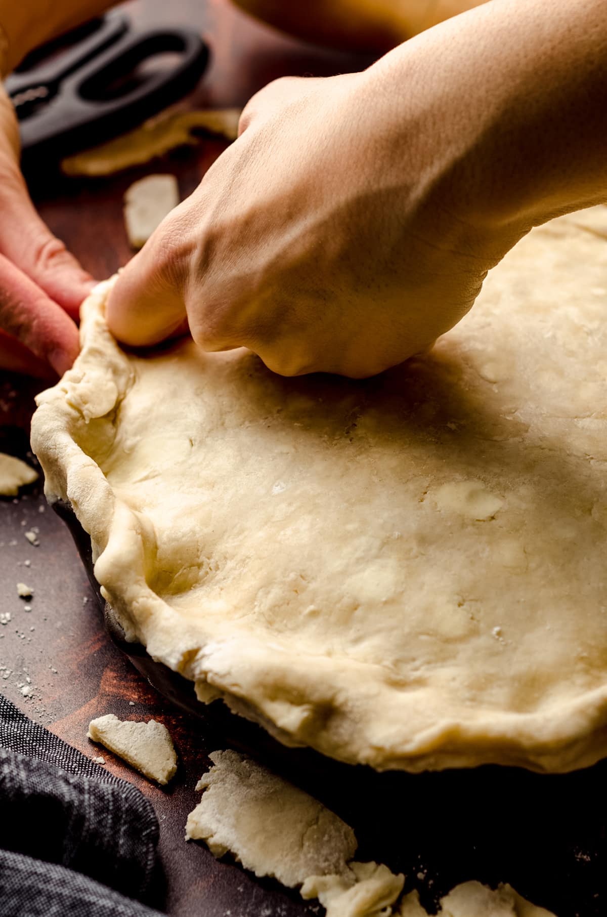 hand crimping a pie crust