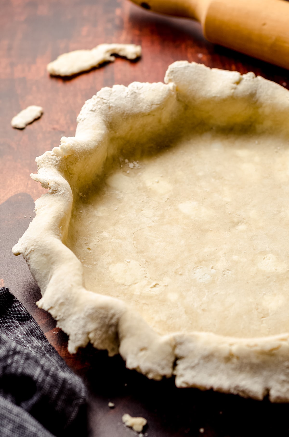 pie crust draped over pie plate for chicken pot pie