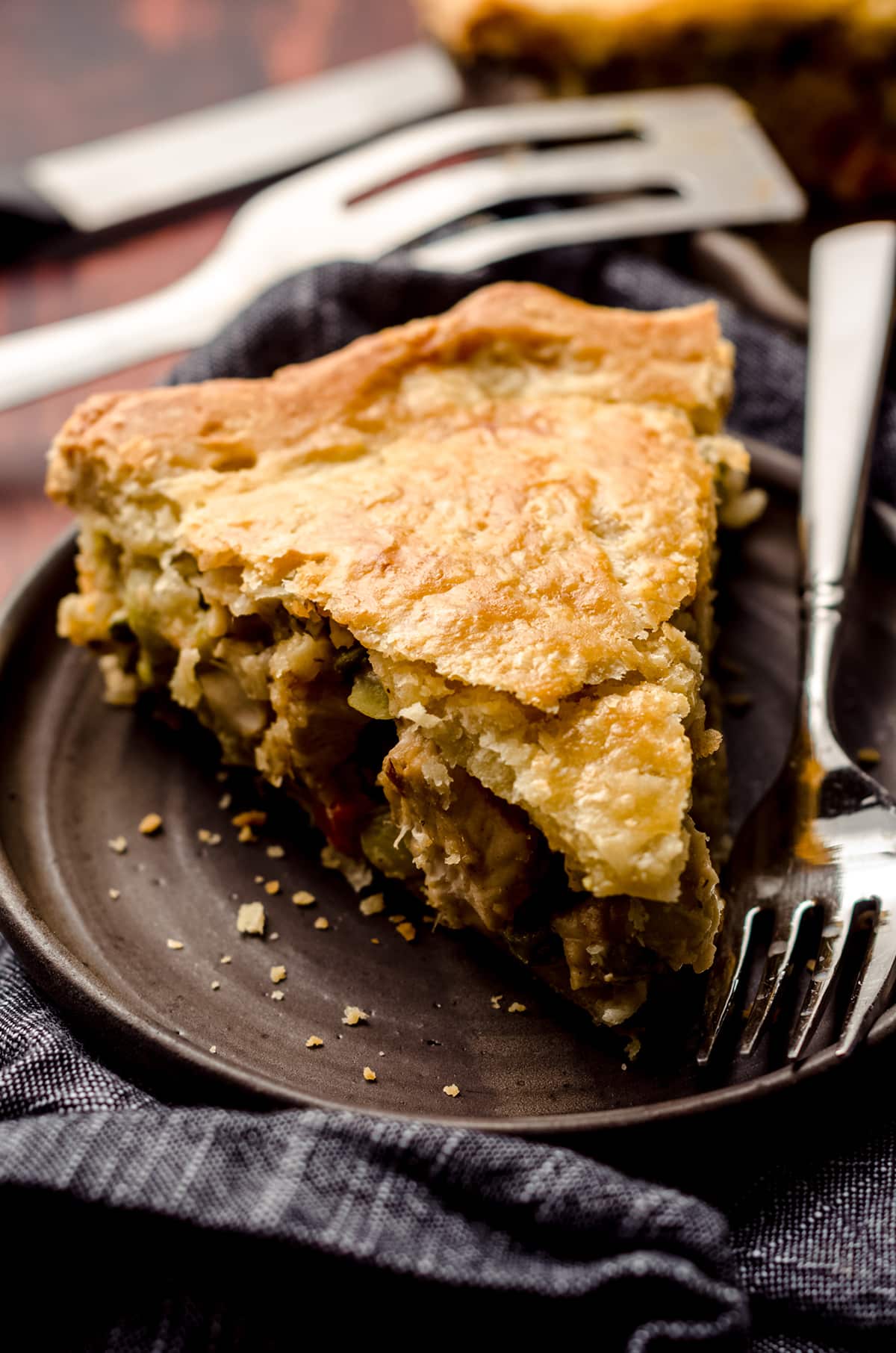 double crust chicken pot pie slice on a plate