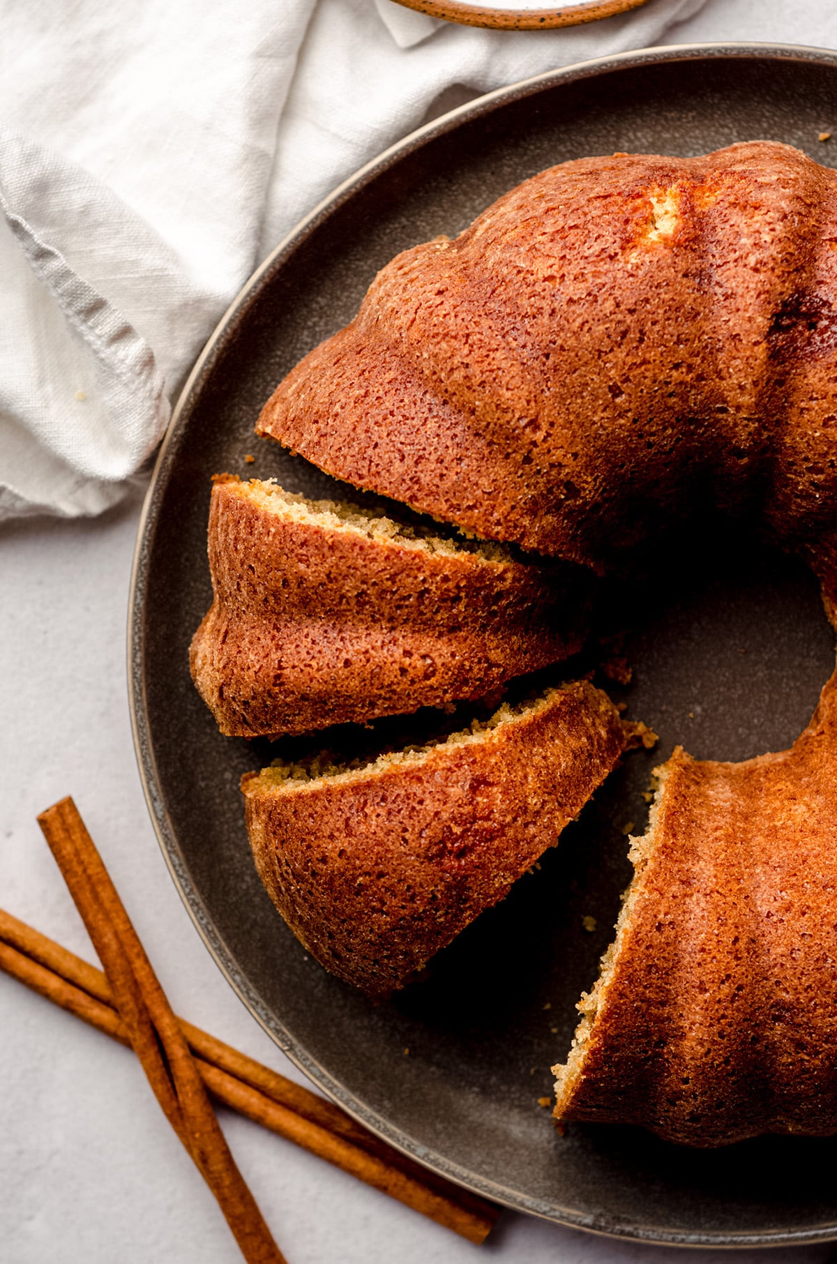 aerial photo of coffee cake bundt sliced on a plate
